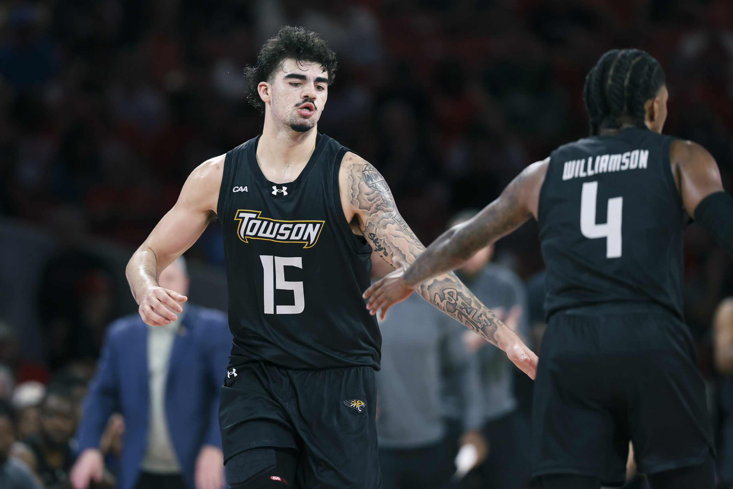 Nov 8, 2025; Houston, Texas, USA; Towson Tigers guard Tyler Tejada (15) reacts after scoring a basket during the second half against the Houston Cougars at Fertitta Center. Mandatory Credit: Troy Taormina-Imagn Images