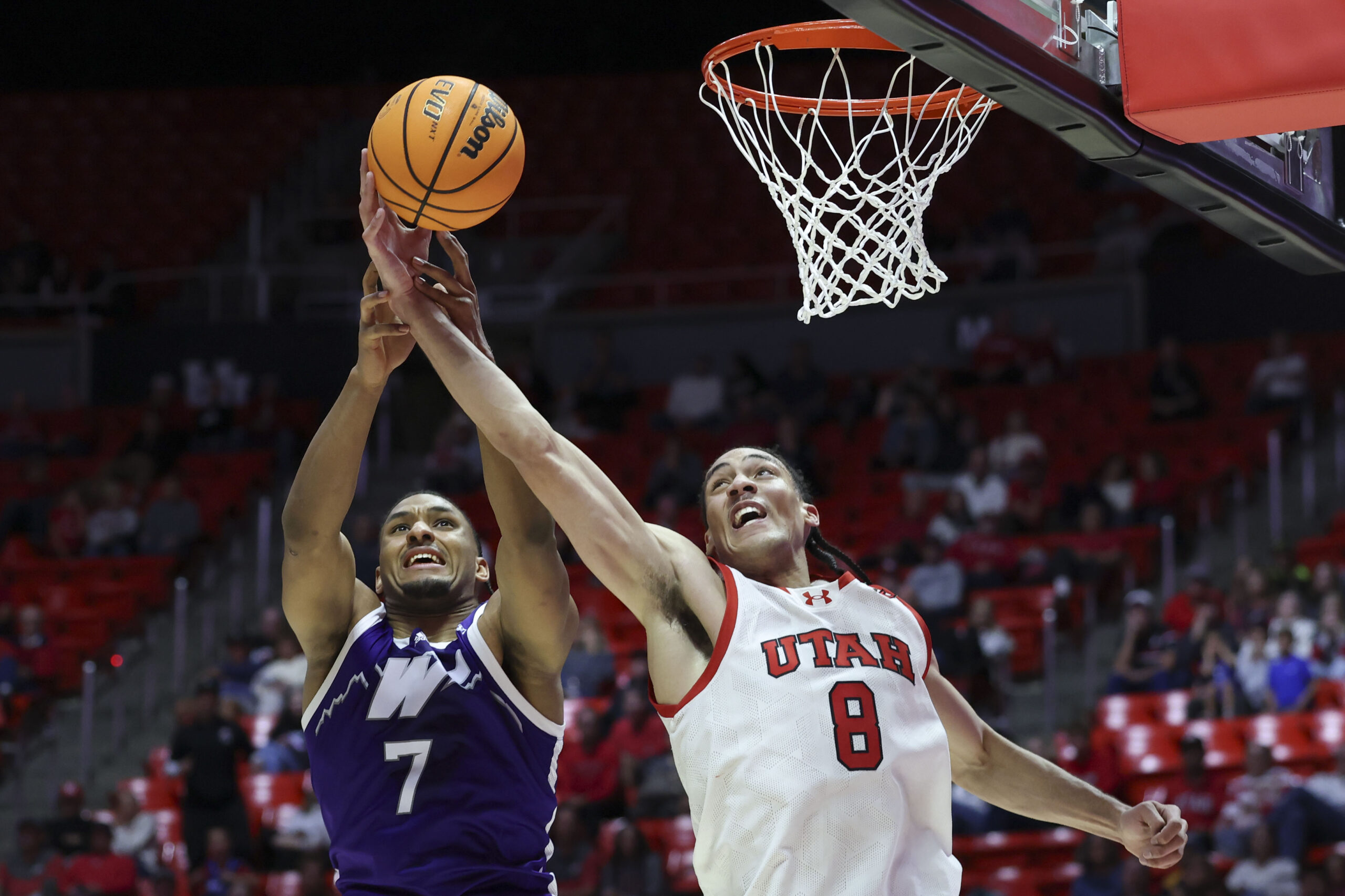 Nov 8, 2025; Salt Lake City, Utah, USA; Weber State Wildcats center Malek Gomma (7) and Utah Utes forward Keanu Dawes (8) battle for a rebound during the second half at Jon M. Huntsman Center. Mandatory Credit: Rob Gray-Imagn Images
