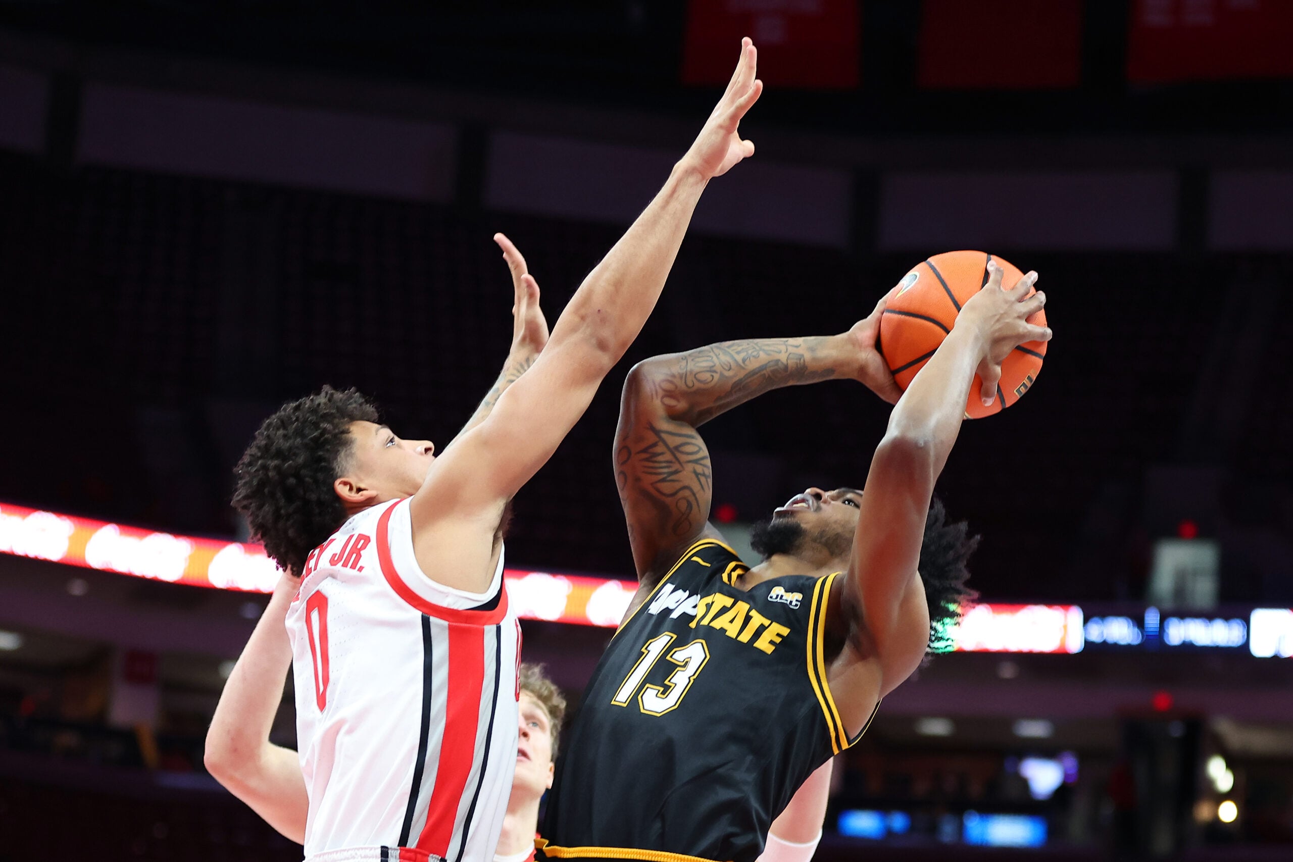 Nov 11, 2025; Columbus, Ohio, USA; Appalachian State Mountaineers guard Kasen Jennings (13) takes a shot against Ohio State Buckeyes guard John Mobley Jr. (0) during the first half at Value City Arena. Mandatory Credit: Joseph Maiorana-Imagn Images