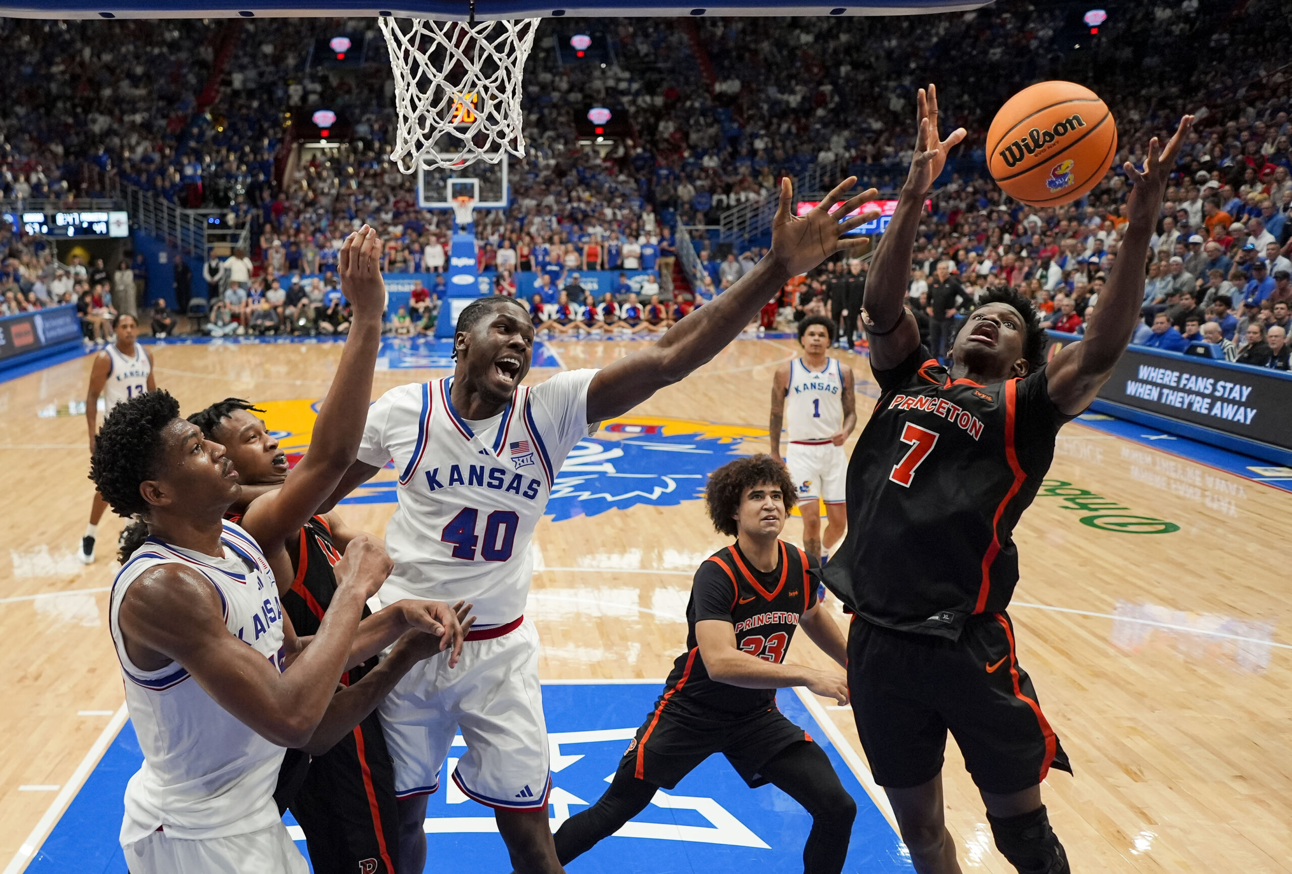 Nov 15, 2025; Lawrence, Kansas, USA; Princeton Tigers forward Malik Abdullahi (7) grabs a rebound during the second half against the Kansas Jayhawks at Allen Fieldhouse. Mandatory Credit: Jay Biggerstaff-Imagn Images