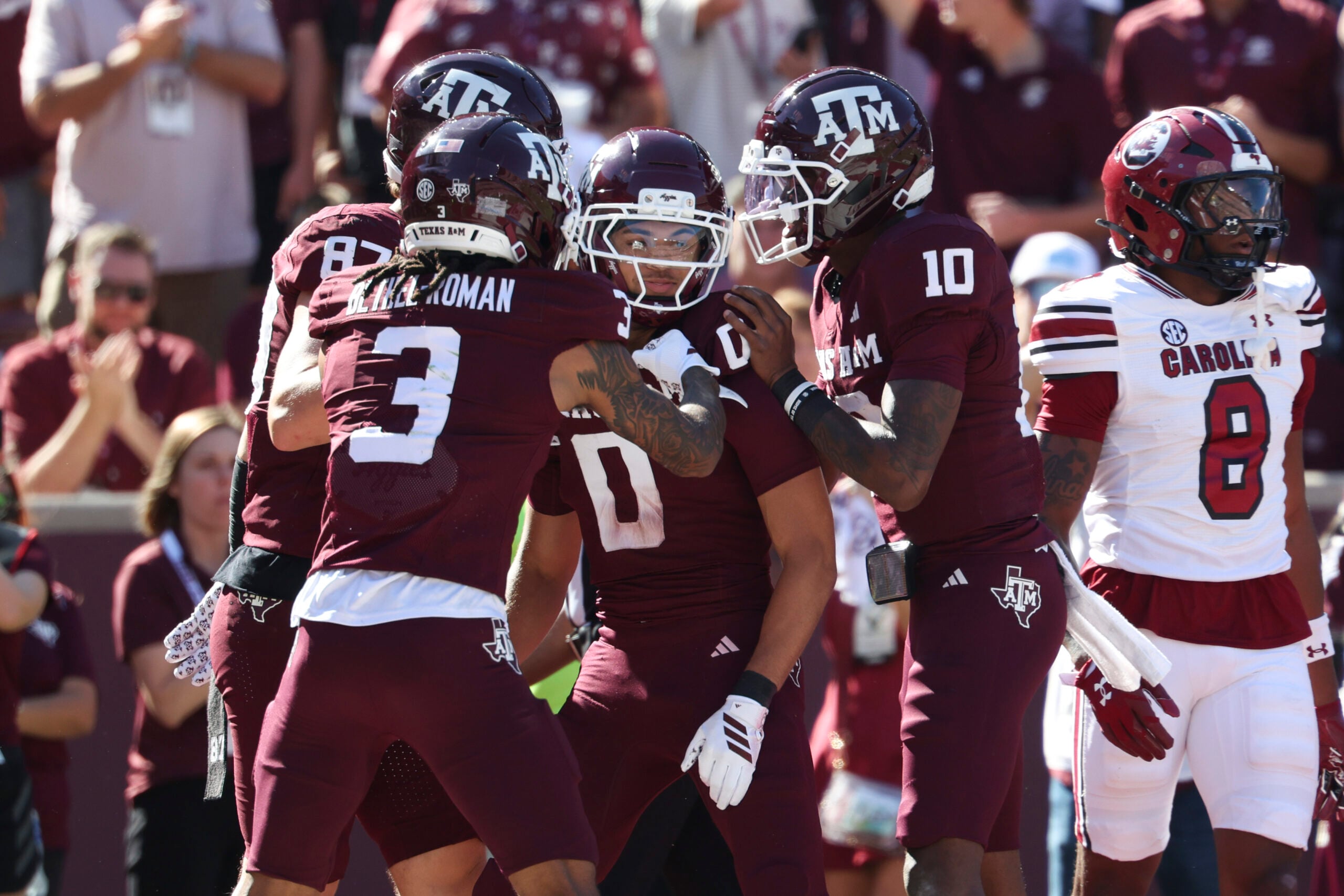 Nov 15, 2025; College Station, Texas, USA; Texas A&M Aggies wide receiver Izaiah Williams (0) celebrates with quarterback Marcel Reed (10) after scoringa a touchdown during the third quarter against the South Carolina Gamecocks at Kyle Field. Mandatory Credit: Troy Taormina-Imagn Images
