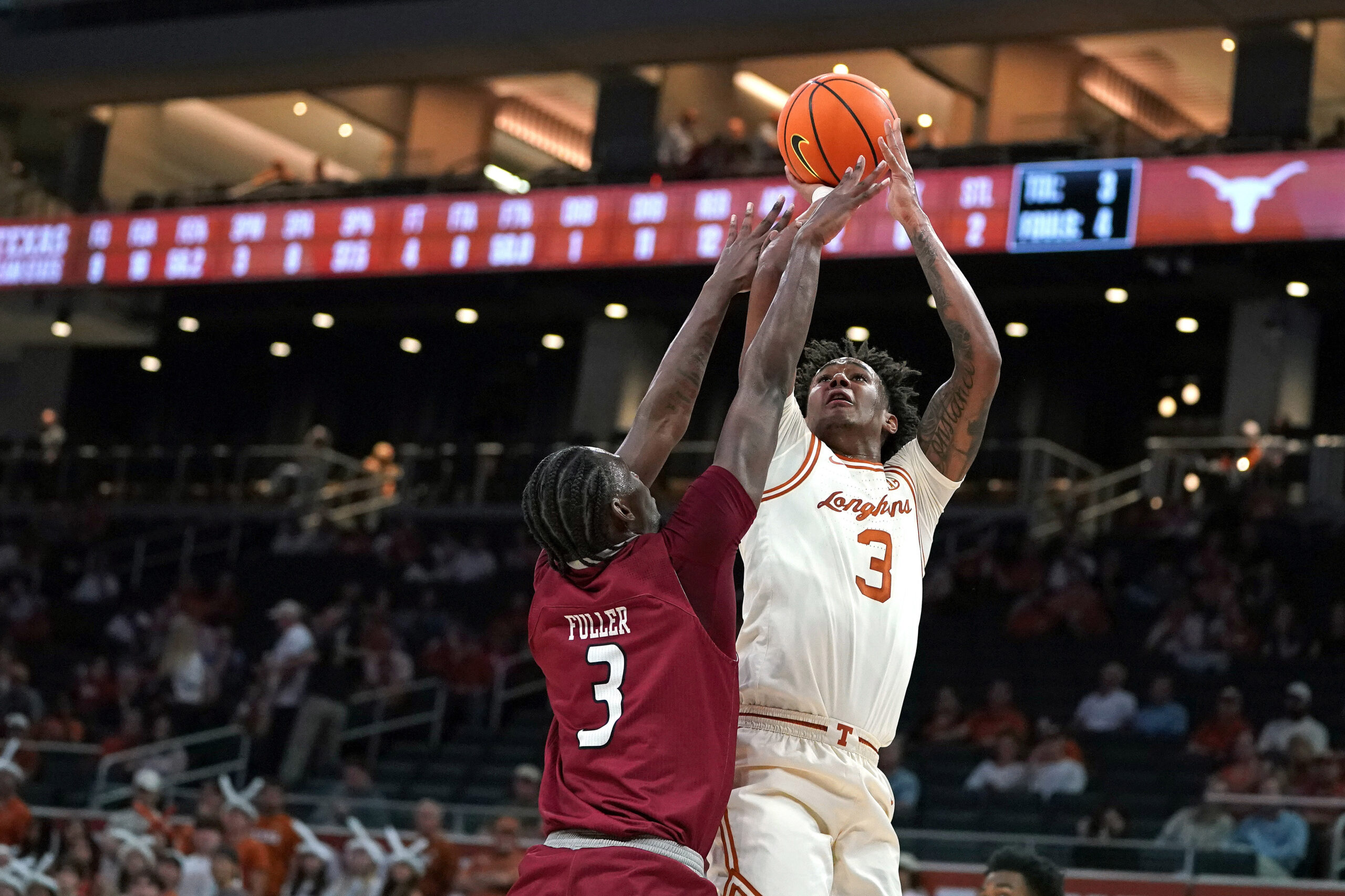 Nov 18, 2025; Austin, Texas, USA; Texas Longhorns guard Dailyn Swain (3) shoots against Rider Broncs forward Shemani Fuller (3) during the first half at Moody Center. Mandatory Credit: Dustin Safranek-Imagn Images