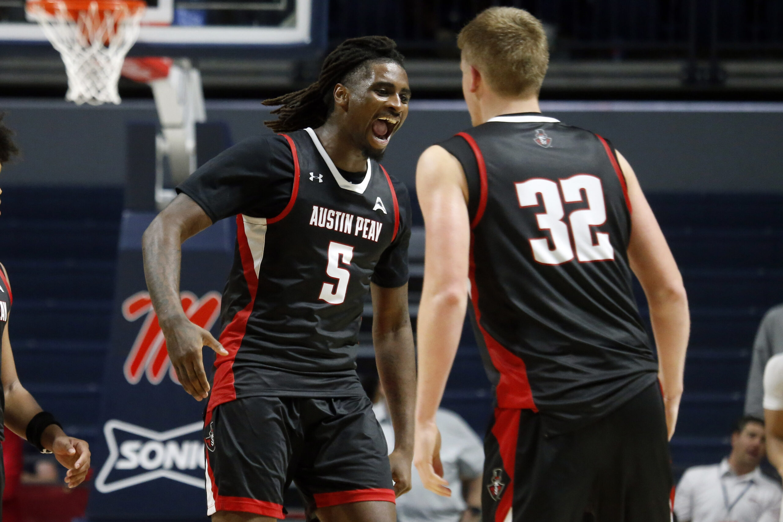 Nov 18, 2025; Oxford, Mississippi, USA; Austin Peay Governors forward Rashaud Marshall (5) reacts with forward Collin Parker (32) after a dunk during the second half against the Mississippi Rebels at The Sandy and John Black Pavilion at Ole Miss. Mandatory Credit: Petre Thomas-Imagn Images