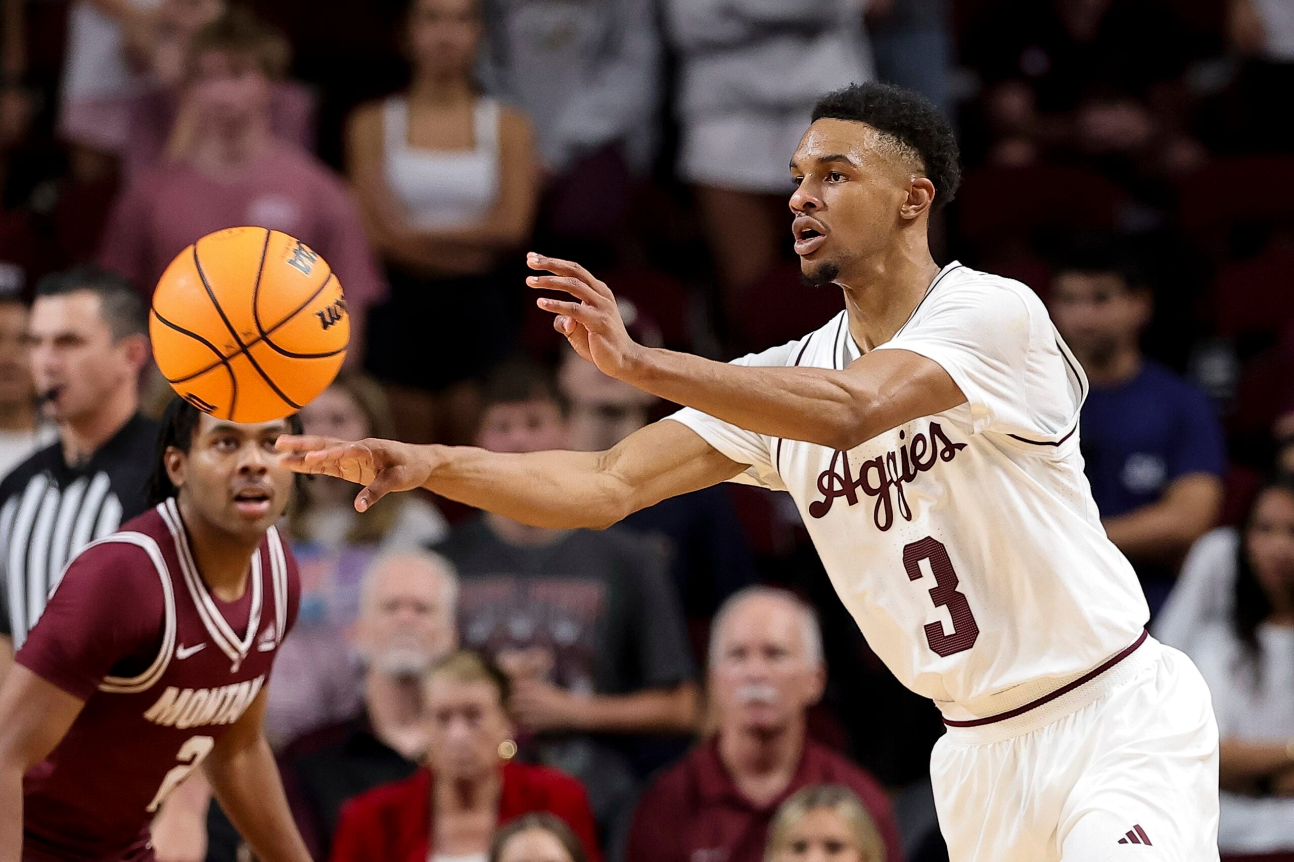 Nov 18, 2025; College Station, Texas, USA; Texas A&M Aggies guard Rylan Griffen (3) passes the ball against the Montana Grizzlies during the second half at Reed Arena. Mandatory Credit: Maria Lysaker-Imagn Images
