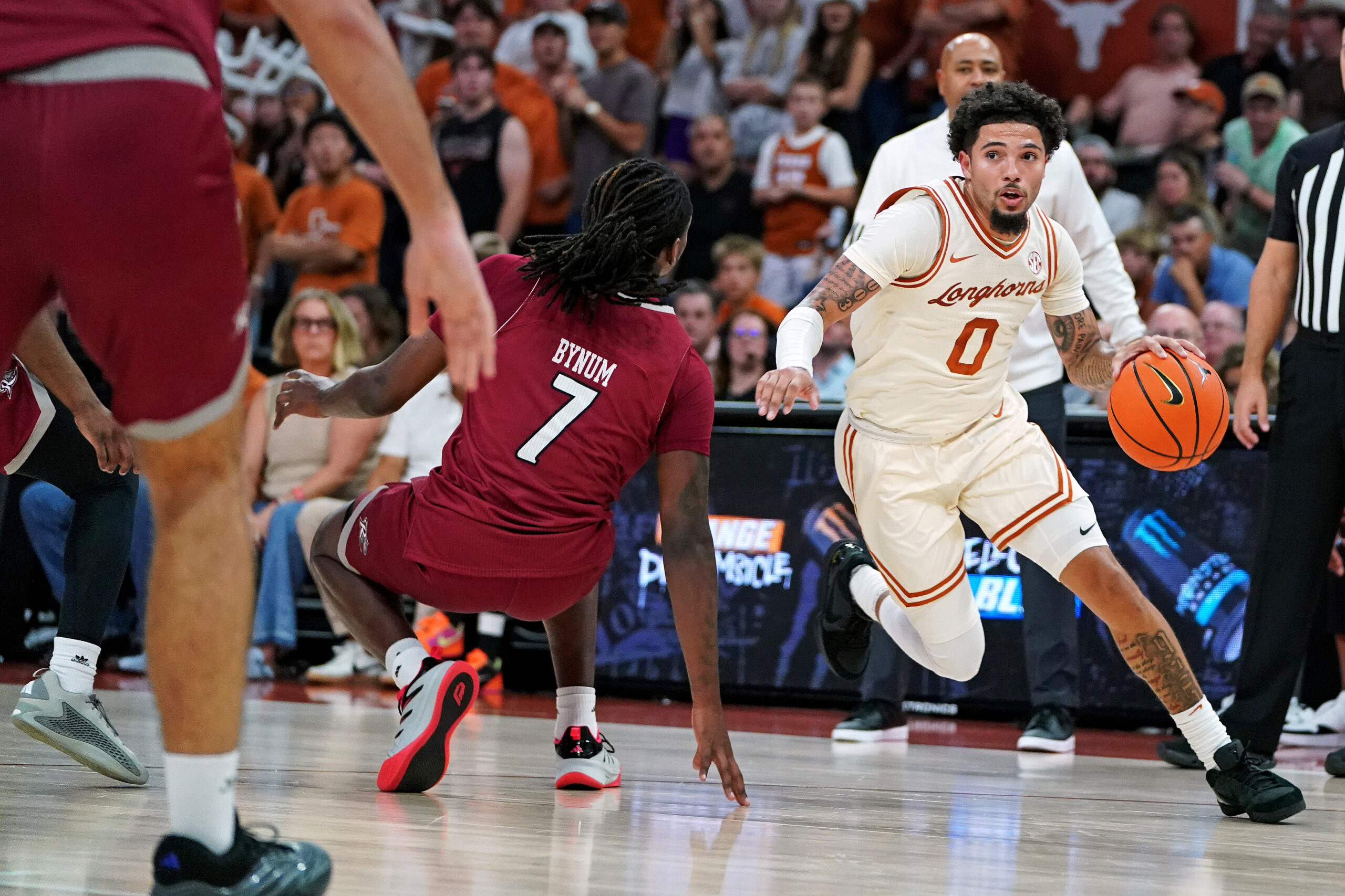 Nov 18, 2025; Austin, Texas, USA; Texas Longhorns guard Jordan Pope (0) drives the ball to the basket against Rider Broncs forward Davis Bynim (7) during the first half at Moody Center. Mandatory Credit: Dustin Safranek-Imagn Images
