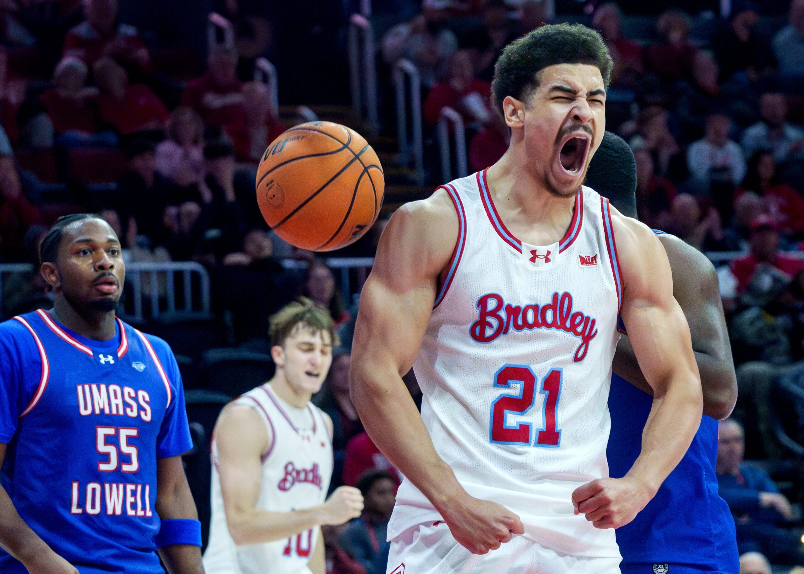 Bradley's AJ Smith reacts to scoring and drawing a foul on a move to the basket against UMass Lowell in the first half of their college basketball game Wednesday, Nov. 19, 2025 at Carver Arena in Peoria. The Braves defeated the River Hawks 87-77.