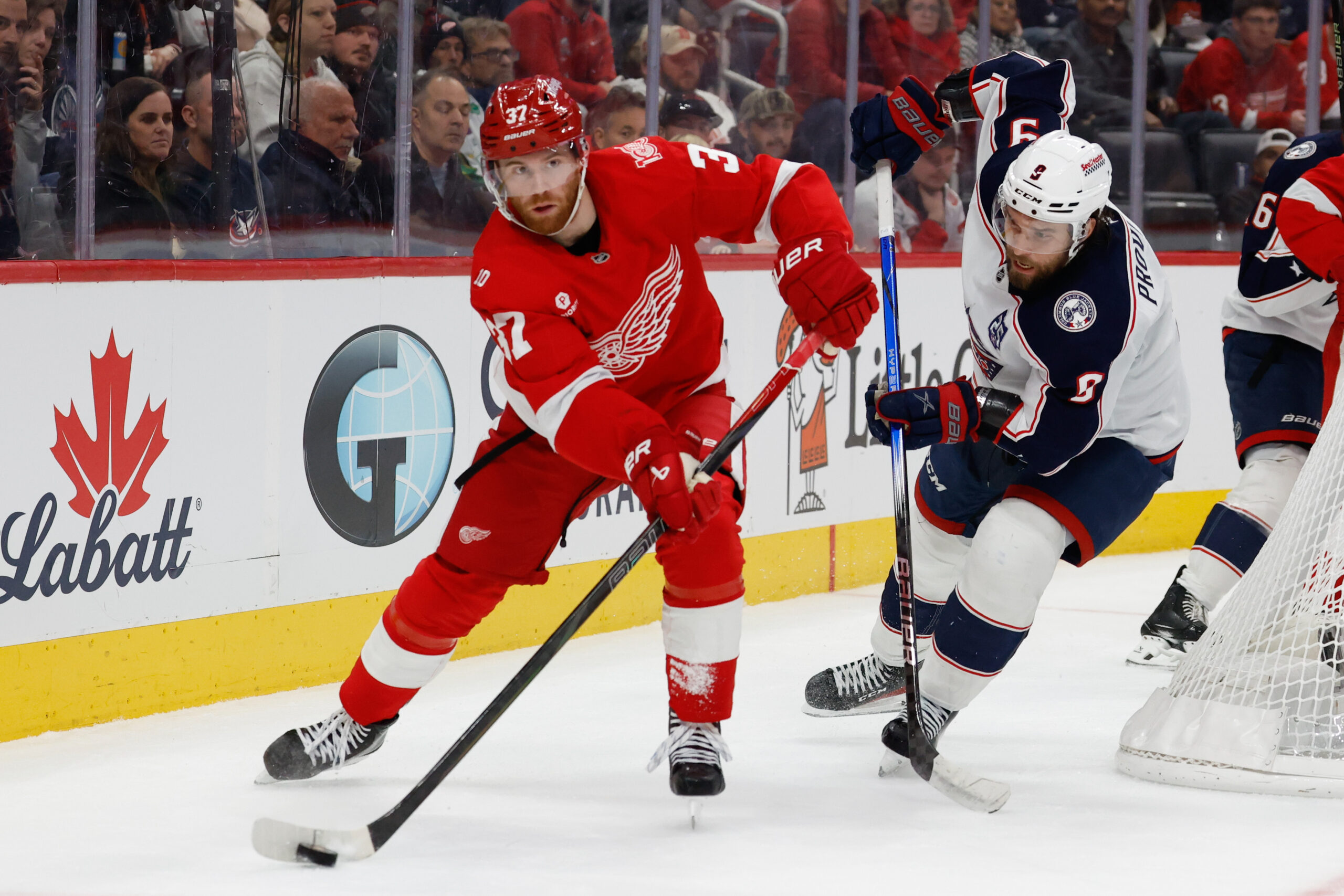 Nov 22, 2025; Detroit, Michigan, USA; Detroit Red Wings left wing J.T. Compher (37) skates with the puck in the second period against the Columbus Blue Jackets at Little Caesars Arena. Mandatory Credit: Rick Osentoski-Imagn Images