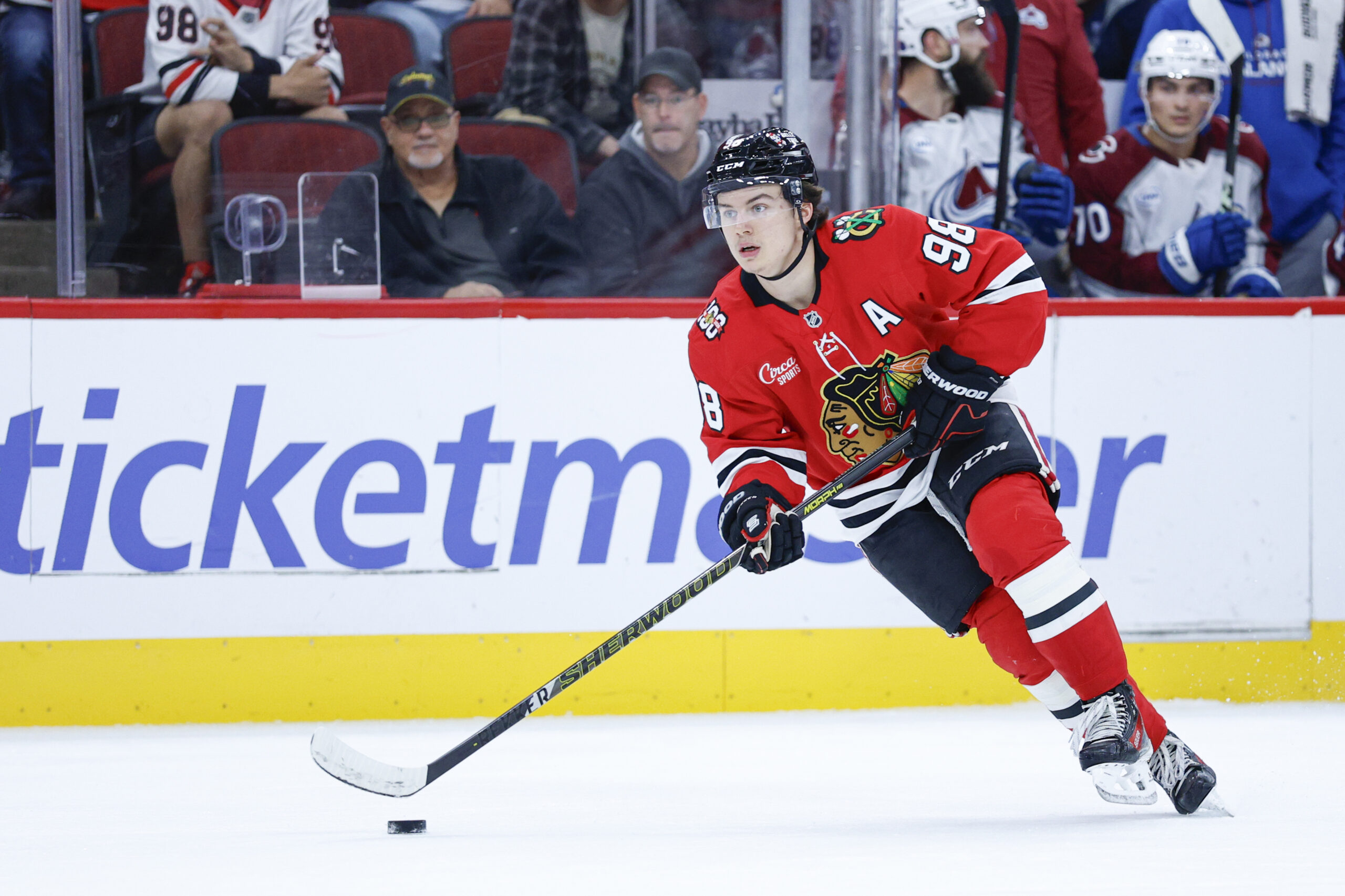Nov 23, 2025; Chicago, Illinois, USA; Chicago Blackhawks center Connor Bedard (98) looks to pass the puck against the Colorado Avalanche during the first period at United Center. Mandatory Credit: Kamil Krzaczynski-Imagn Images