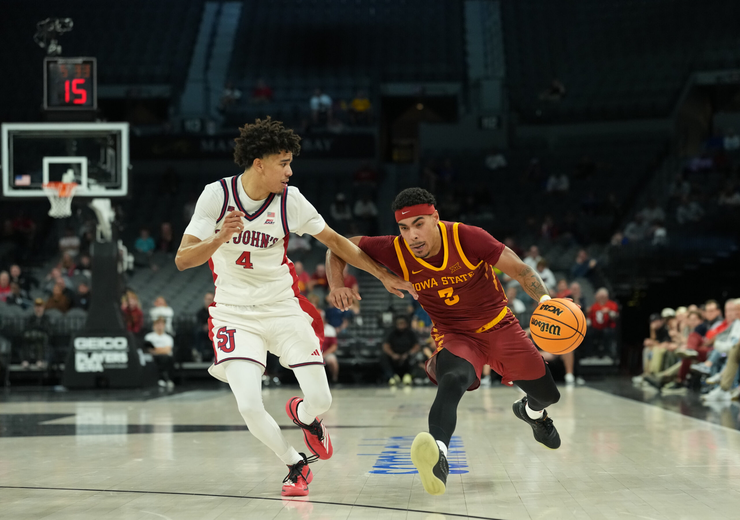 Nov 24, 2025; Las Vegas, Nevada, USA; Iowa State Cyclones guard Tamin Lipsey (3) drives to the hoop past St. John's Red Storm guard Oziyah Sellers (4) during the second half in a 2025 Players Era Festival group play game at Michelob Ultra Arena. Mandatory Credit: Kirby Lee-Imagn Images