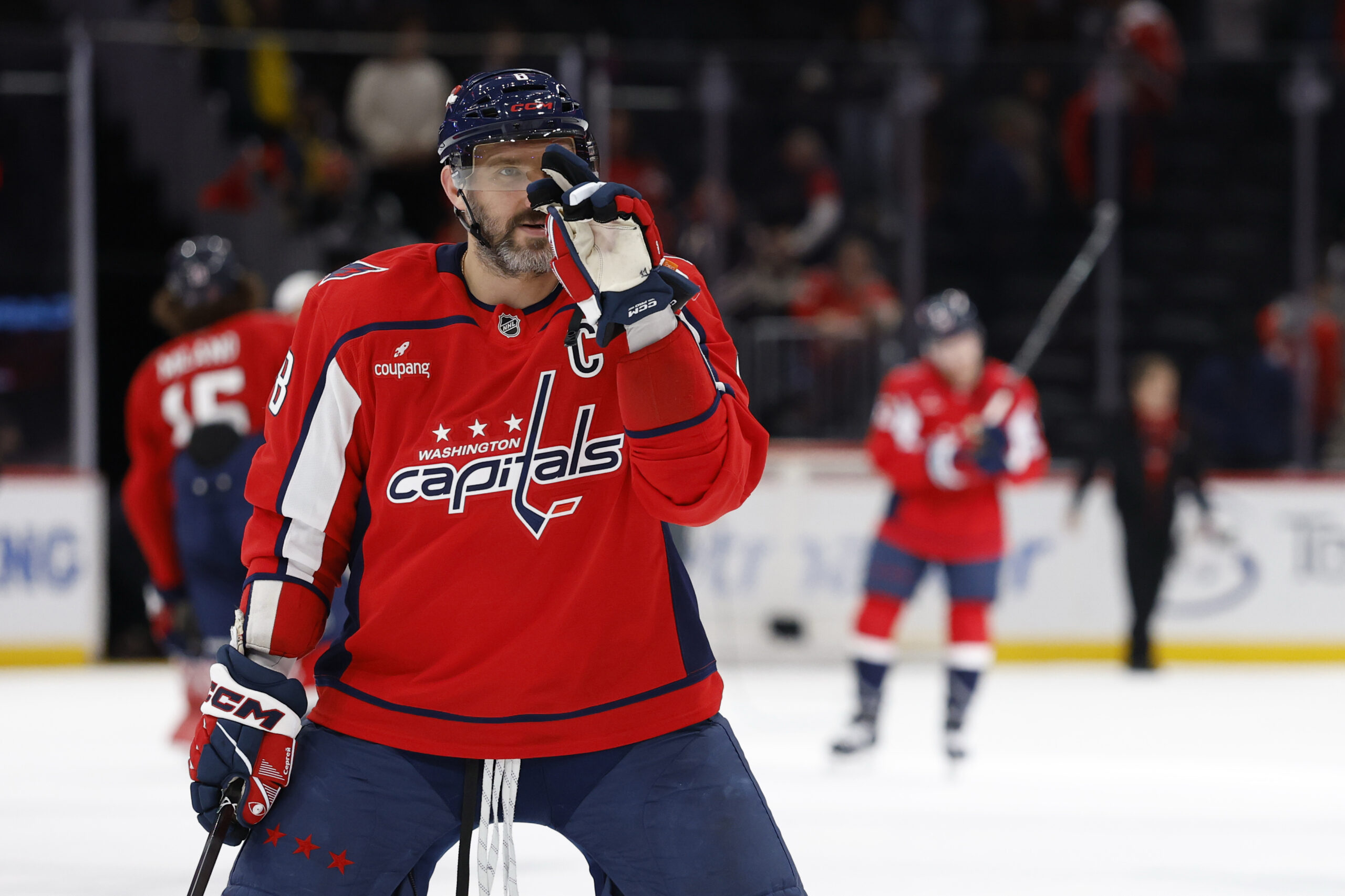 Nov 24, 2025; Washington, District of Columbia, USA; Washington Capitals left wing Alex Ovechkin (8) gestures to his son Sergei (not pictured) after the Capitals' game against the Columbus Blue Jackets at Capital One Arena. Mandatory Credit: Geoff Burke-Imagn Images