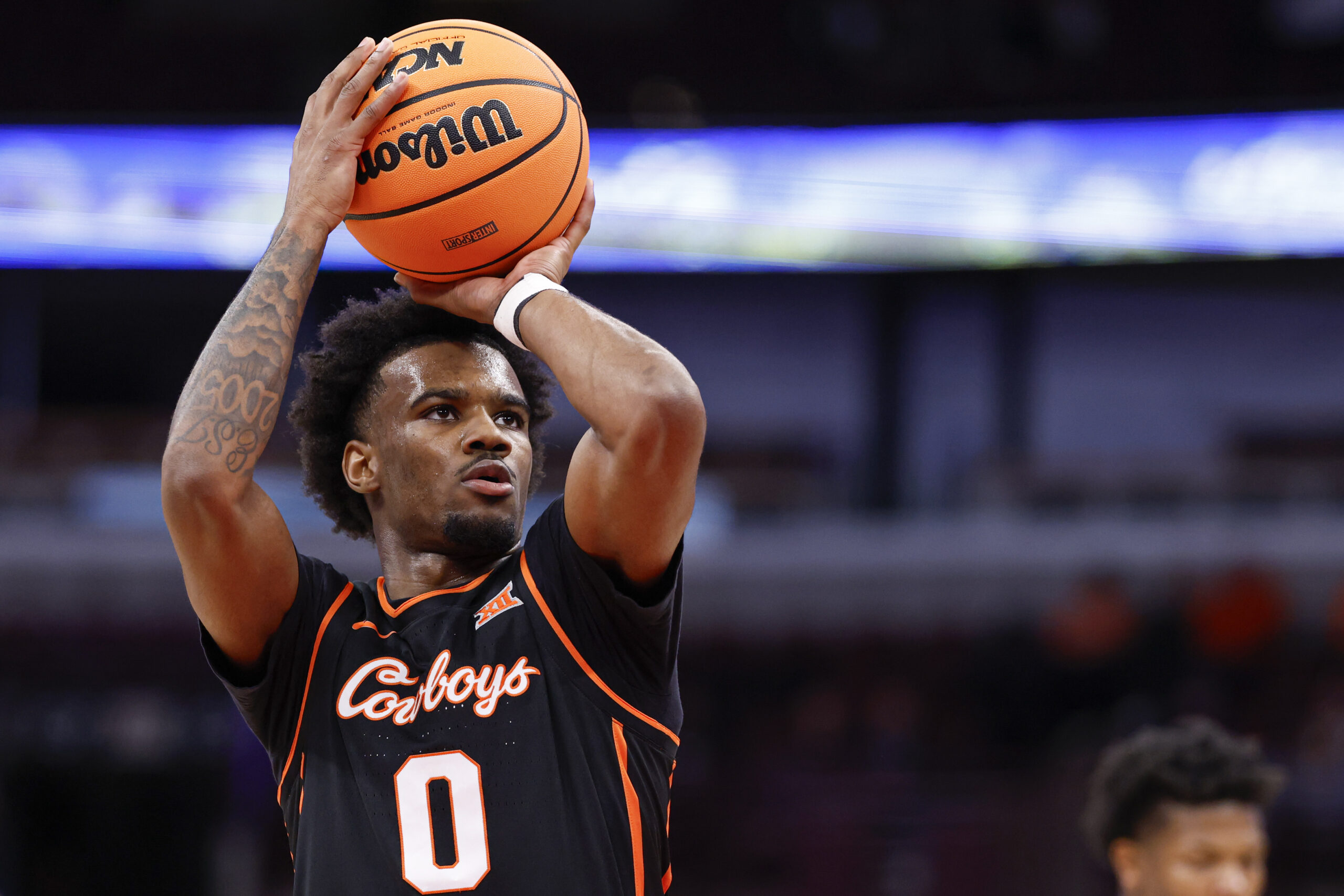 Nov 27, 2025; Chicago, Illinois, USA; Oklahoma State Cowboys guard Jaylen Curry (0) shoots a free throw against Northwestern Wildcats during the first half at United Center. Mandatory Credit: Kamil Krzaczynski-Imagn Images