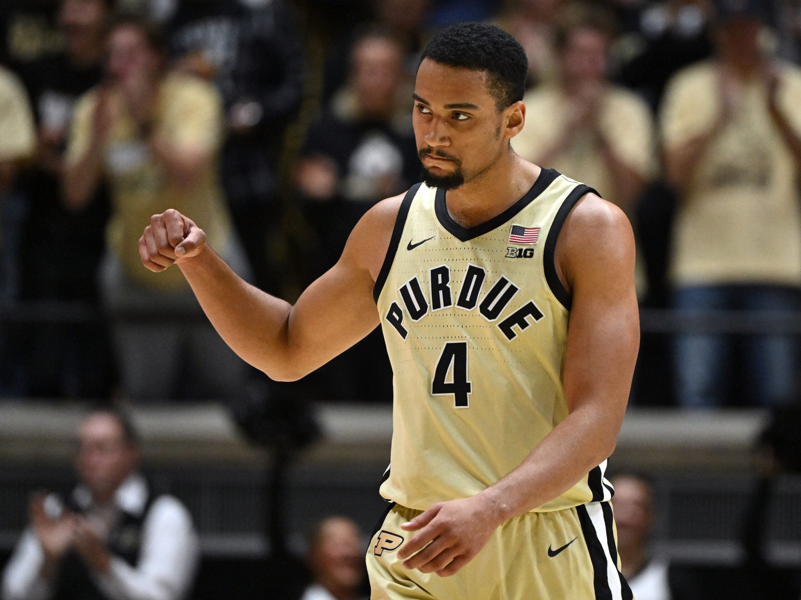 Nov 28, 2025; West Lafayette, Indiana, USA; Purdue Boilermakers forward Trey Kaufman-Renn (4) celebrates a basket during a timeout during the second half against the Eastern Illinois Panthers at Mackey Arena. Mandatory Credit: Marc Lebryk-Imagn Images