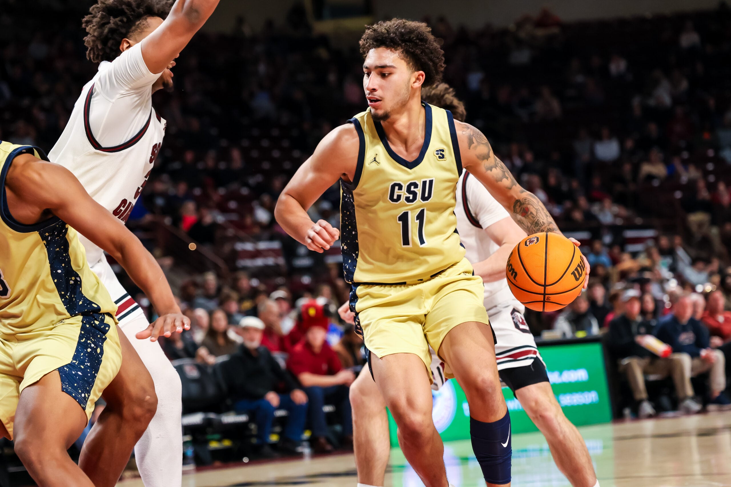 Nov 28, 2025; Columbia, South Carolina, USA; Charleston Southern Buccaneers guard Brycen Blaine (11) drives against the South Carolina Gamecocks in the second half at Colonial Life Arena. Mandatory Credit: Jeff Blake-Imagn Images