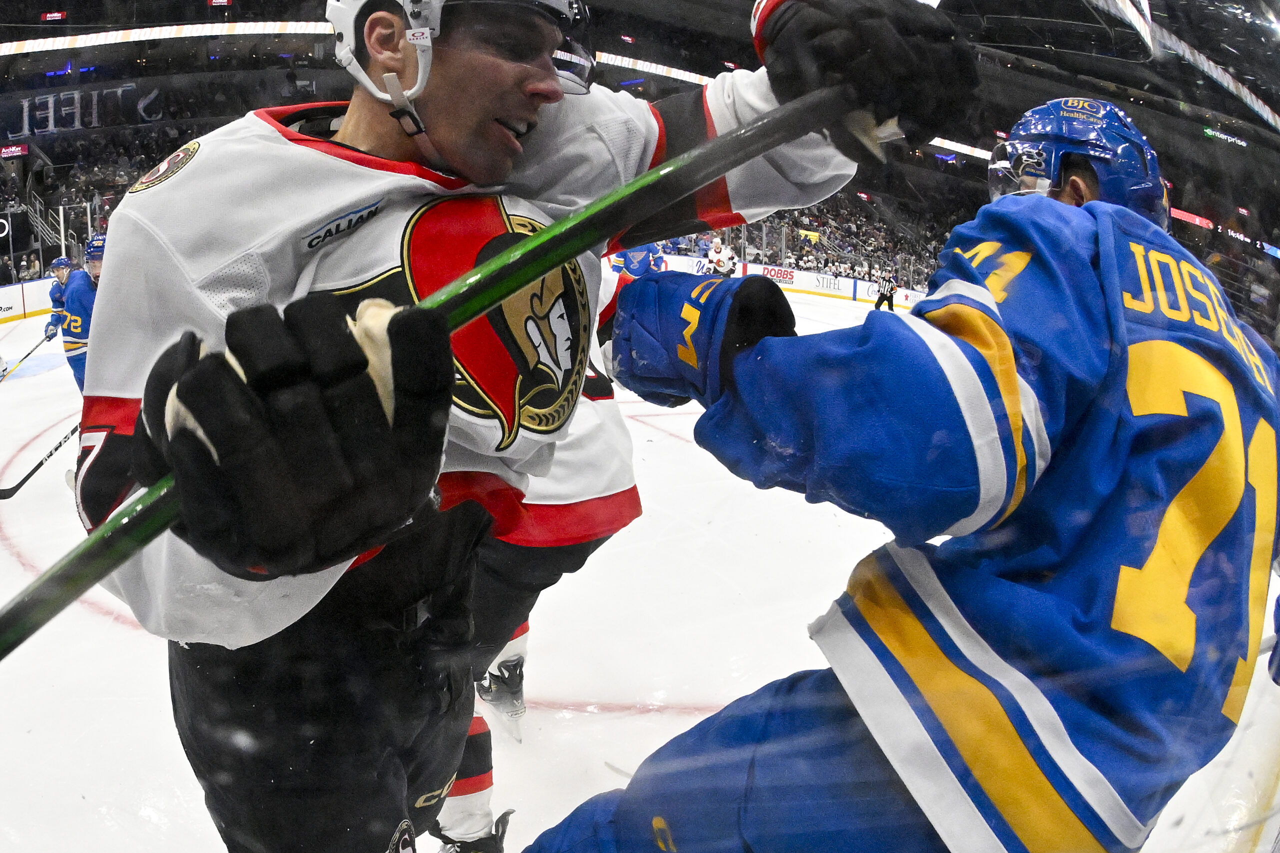 Nov 28, 2025; St. Louis, Missouri, USA; Ottawa Senators left wing David Perron (57) checks St. Louis Blues right wing Mathieu Joseph (71) during the third period at Enterprise Center. Mandatory Credit: Jeff Curry-Imagn Images