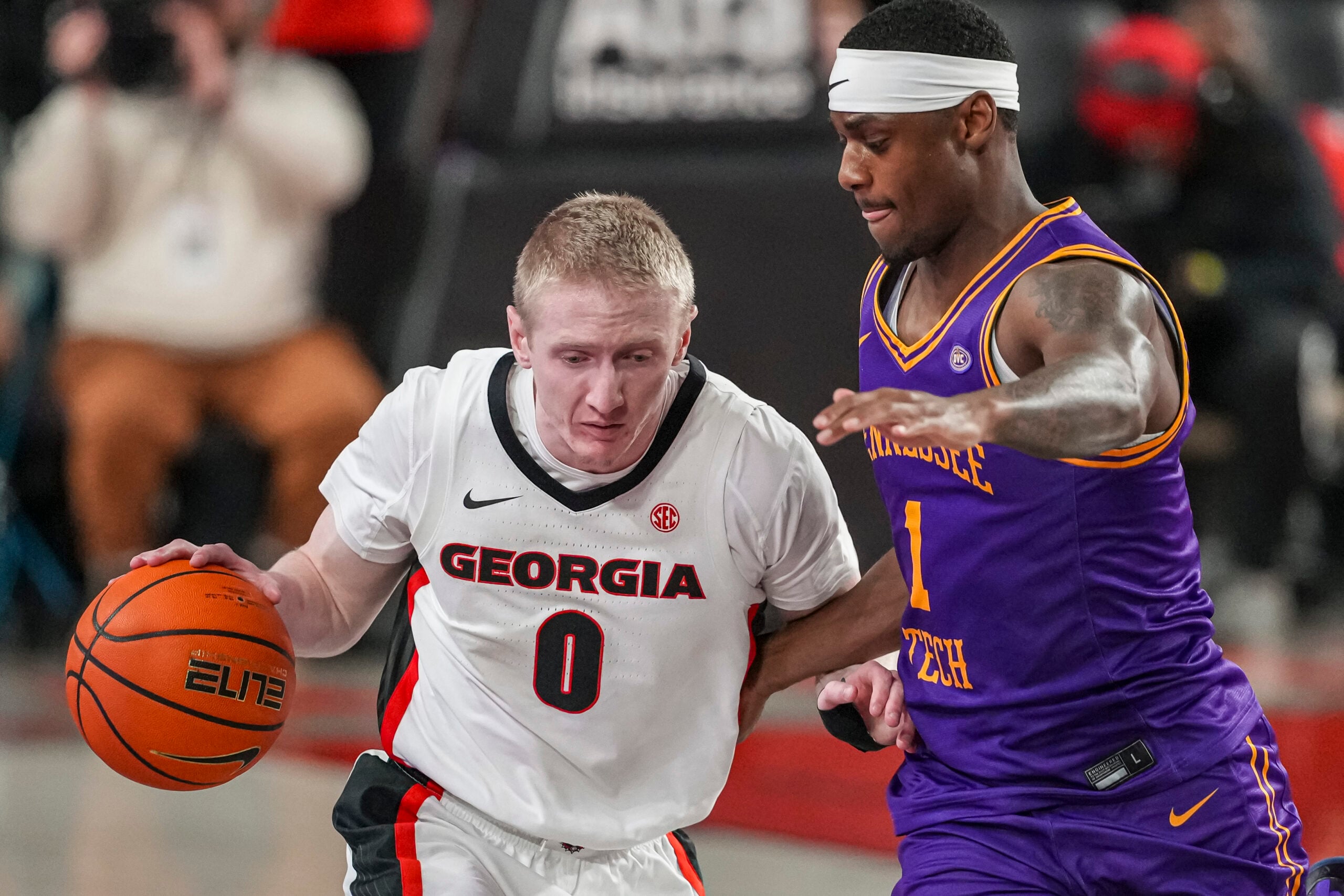 Nov 29, 2025; Athens, Georgia, USA; Georgia Bulldogs guard Blue Cain (0) dribbles against Tennessee Tech Golden Eagles guard Mekhi Cameron (1) during the second half at Stegeman Coliseum. Mandatory Credit: Dale Zanine-Imagn Images