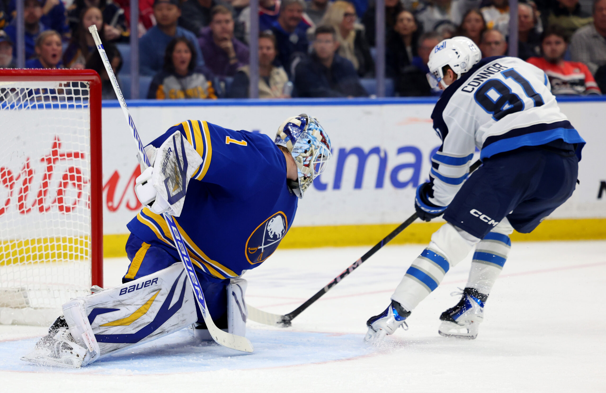 Dec 1, 2025; Buffalo, New York, USA; Buffalo Sabres goaltender Ukko-Pekka Luukkonen (1) makes a save on Winnipeg Jets left wing Kyle Connor (81) during the third period at KeyBank Center. Mandatory Credit: Timothy T. Ludwig-Imagn Images