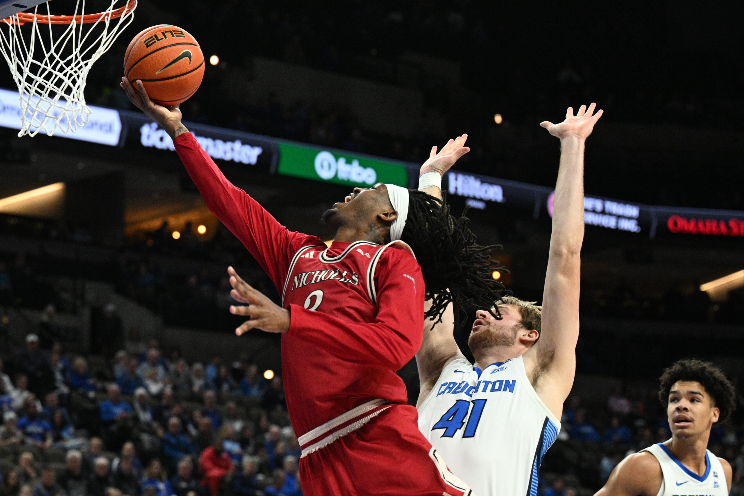 Dec 2, 2025; Omaha, Nebraska, USA;  Nicholls State Colonels forward Jaylen Searles (3) drives against Creighton Bluejays forward Isaac Traudt (41) during the first half at CHI Health Center Omaha. Mandatory Credit: Steven Branscombe-Imagn Images