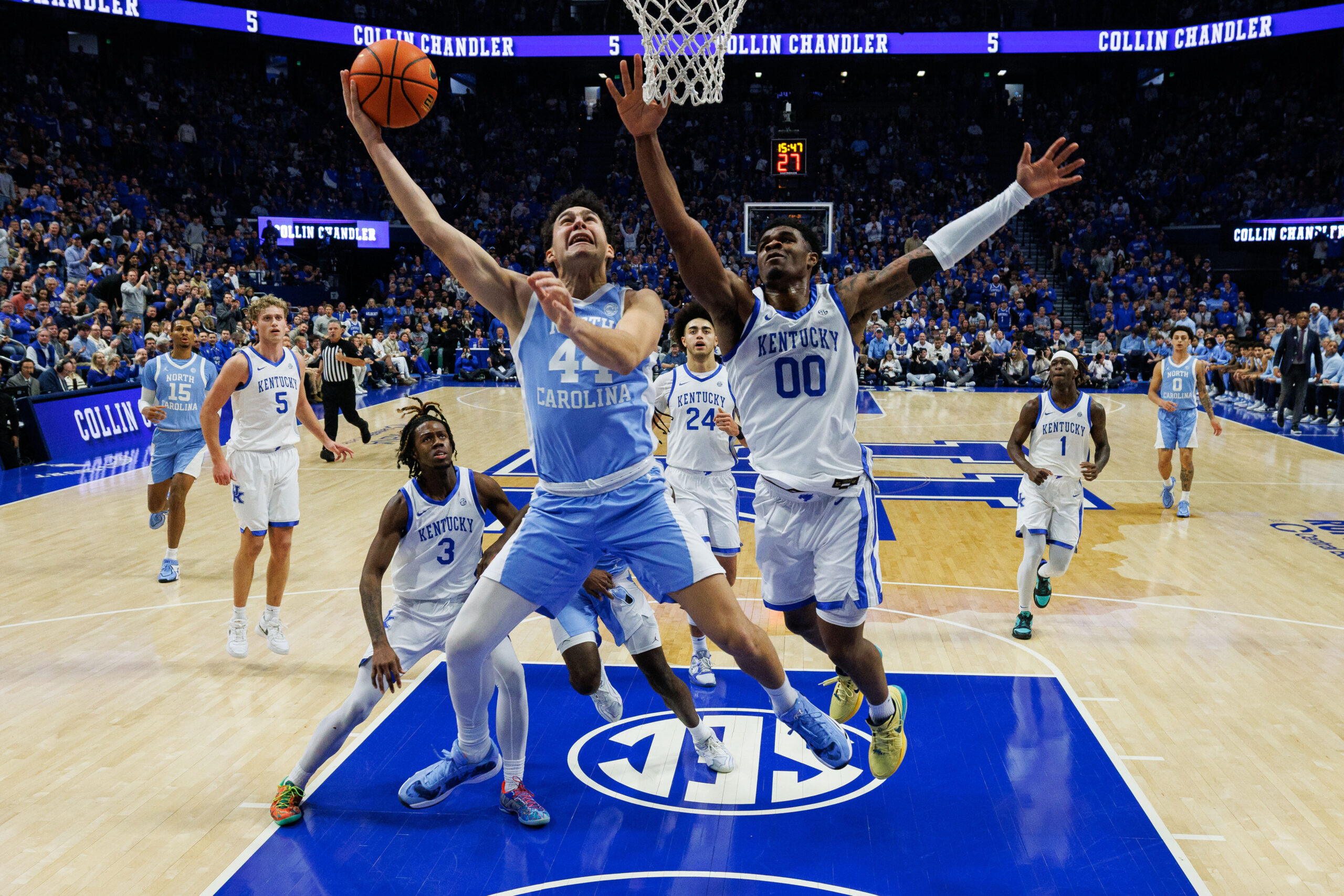 Dec 2, 2025; Lexington, Kentucky, USA; North Carolina Tar Heels guard Luka Bogavac (44) goes to the basket agaisnt Kentucky Wildcats guard Otega Oweh (00) during the first half at Rupp Arena at Central Bank Center. Mandatory Credit: Jordan Prather-Imagn Images