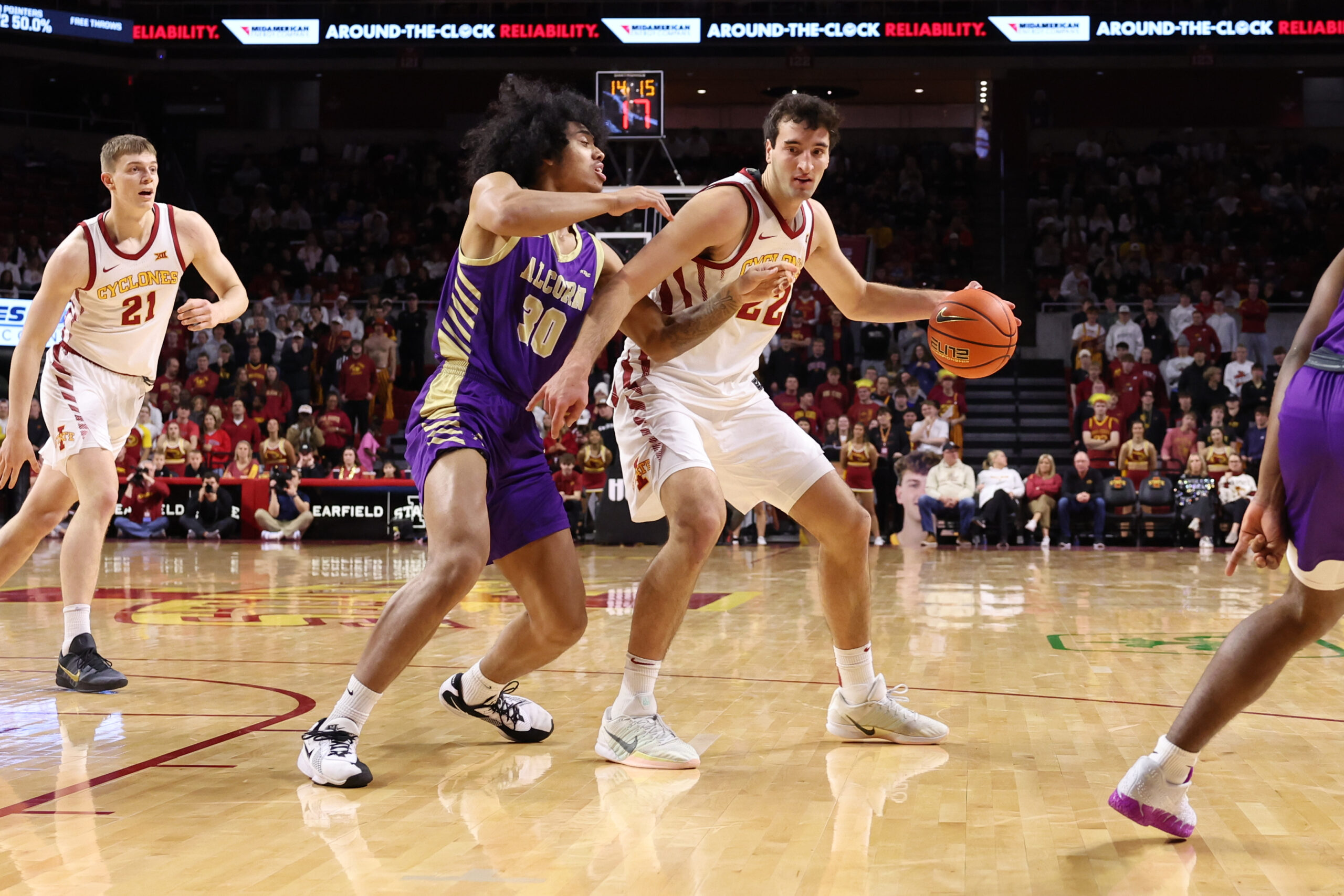 Dec 3, 2025; Ames, Iowa, USA; Alcorn State Braves guard Travis Roberts (30) defends Iowa State Cyclones forward Milan Momcilovic (22) during the first half at James H. Hilton Coliseum. Mandatory Credit: Reese Strickland-Imagn Images