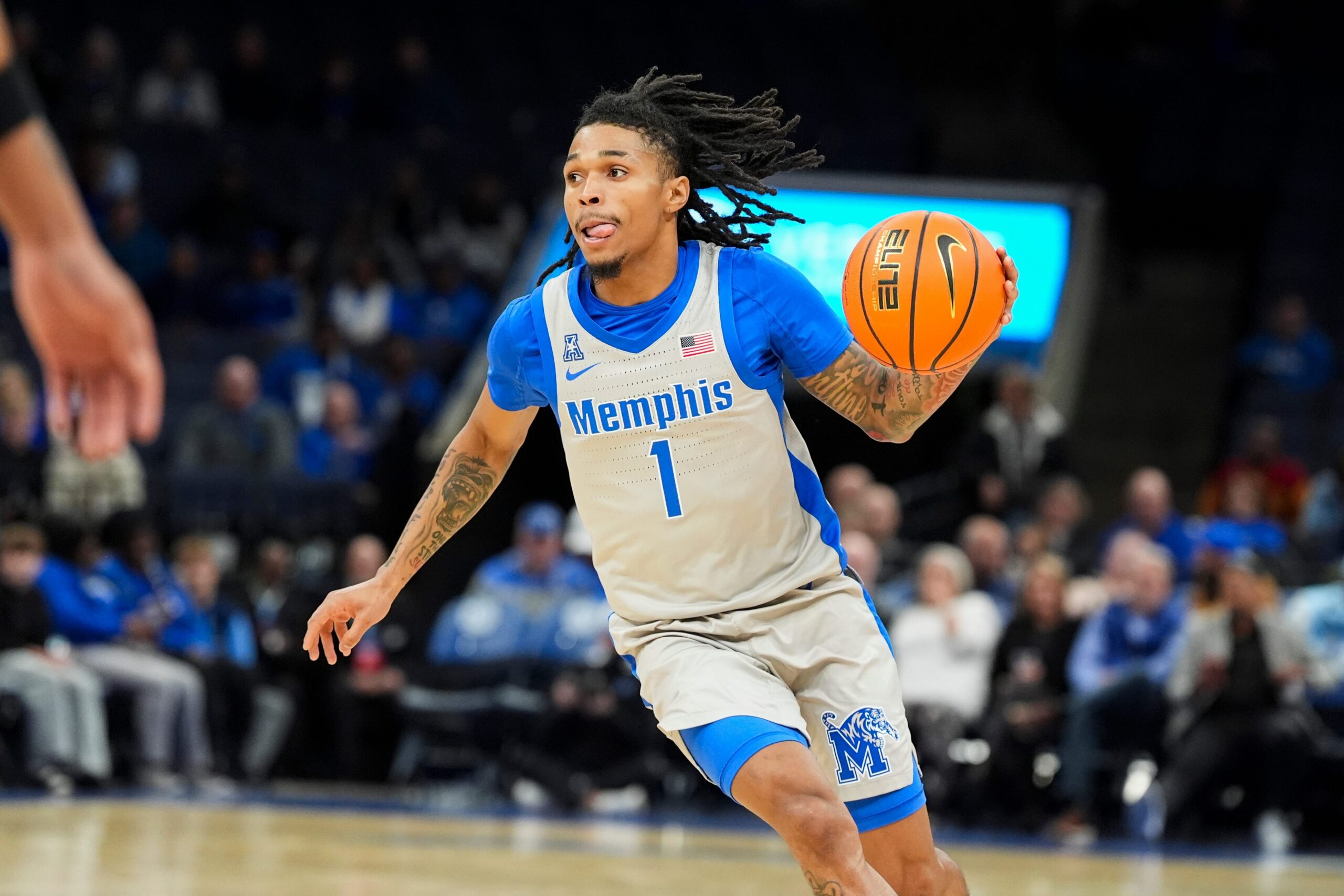 Memphis' Dug McDaniel (1) drives to the basket during the game between the University of New Orleans and the University of Memphis at FedExForum on December 3, 2025.