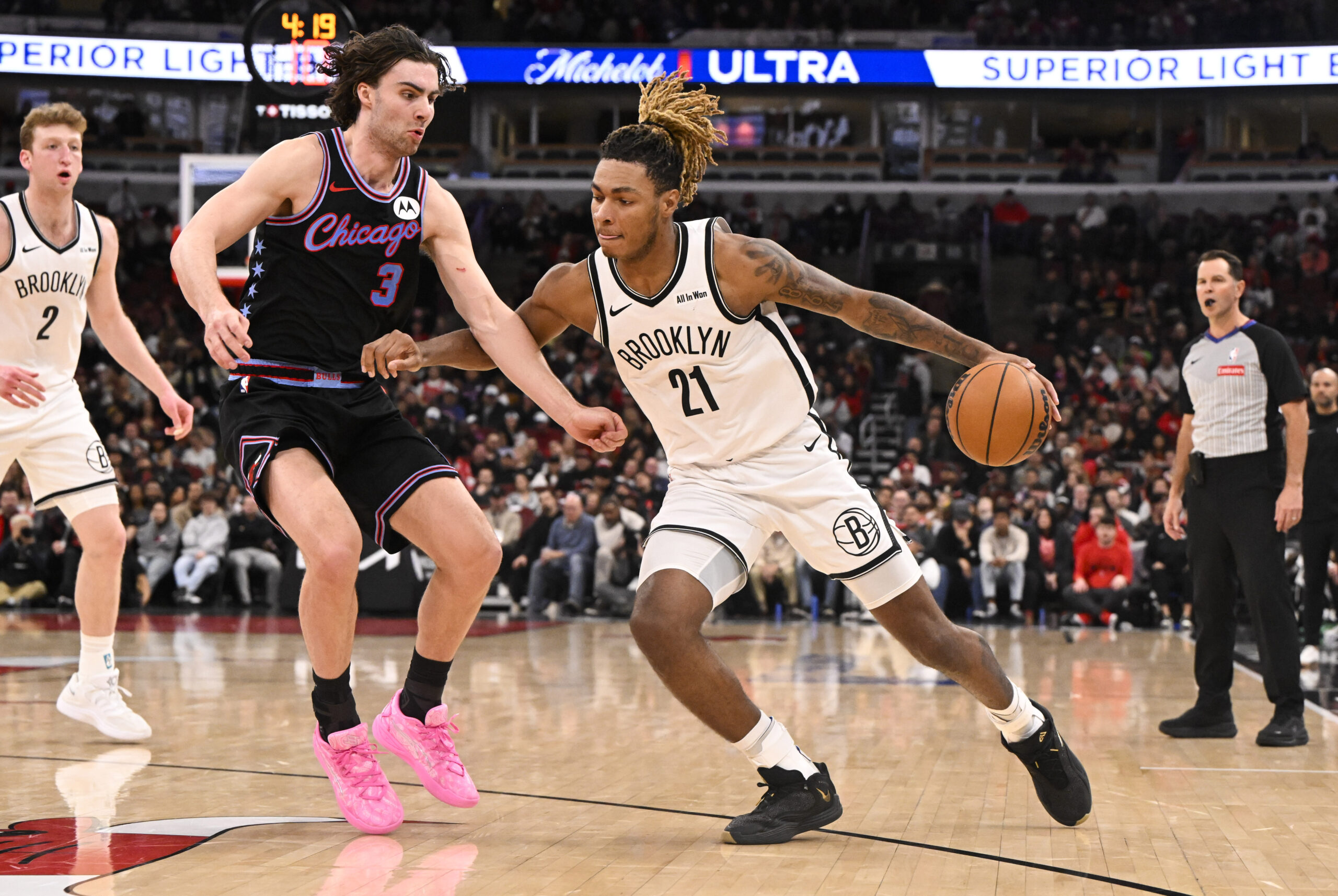 Dec 3, 2025; Chicago, Illinois, USA;  Brooklyn Nets forward Noah Clowney (21) dribbles against Chicago Bulls guard Josh Giddey (3) during the second half at the United Center. Mandatory Credit: Matt Marton-Imagn Images