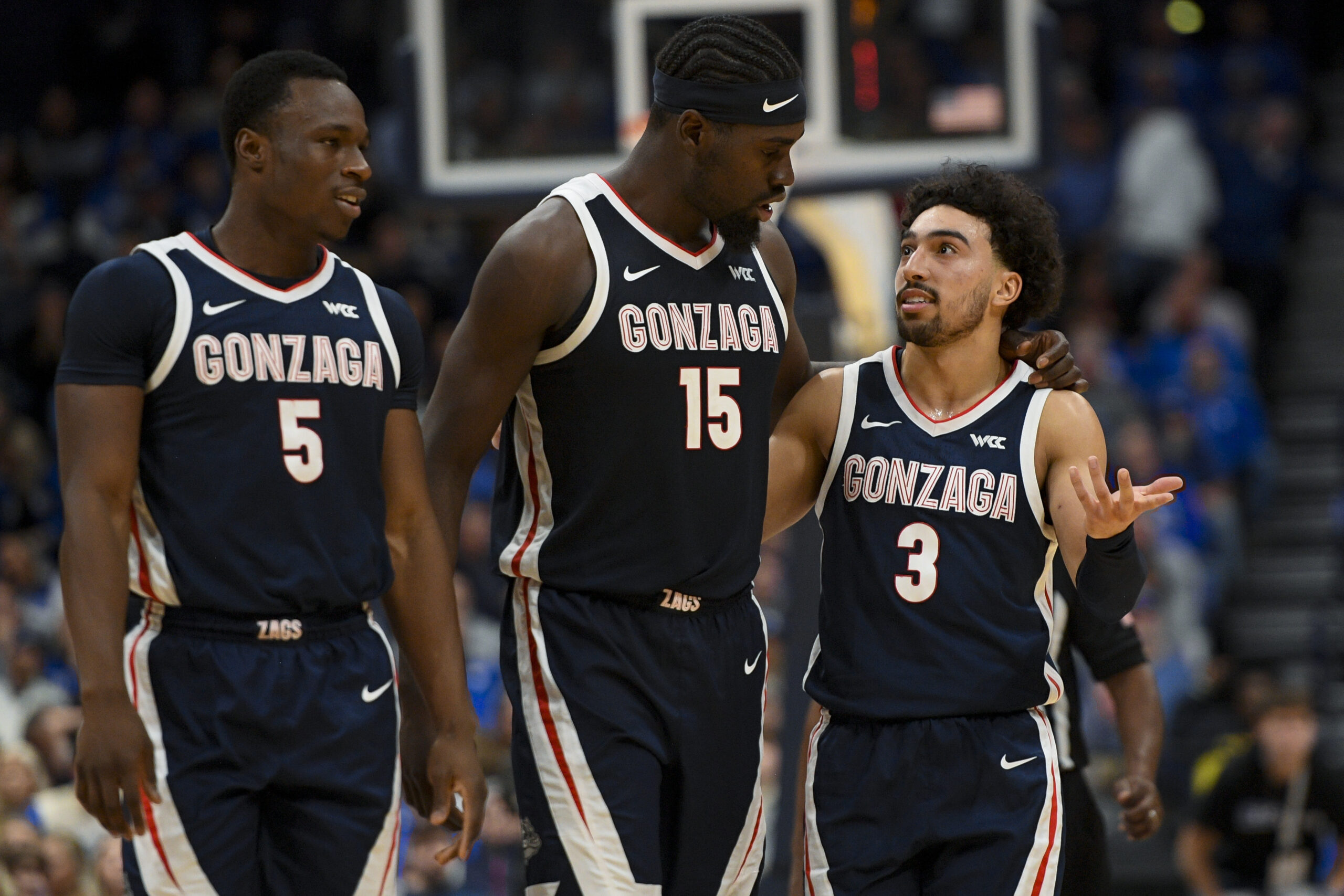 Dec 5, 2025; Nashville, TN, USA;  Gonzaga Bulldogs forward Emmanuel Innocenti (5), forward Graham Ike (15), and guard Braeden Smith (3) walk back to the bench against the Kentucky Wildcats during the first half at Bridgestone Arena. Mandatory Credit: Steve Roberts-Imagn Images