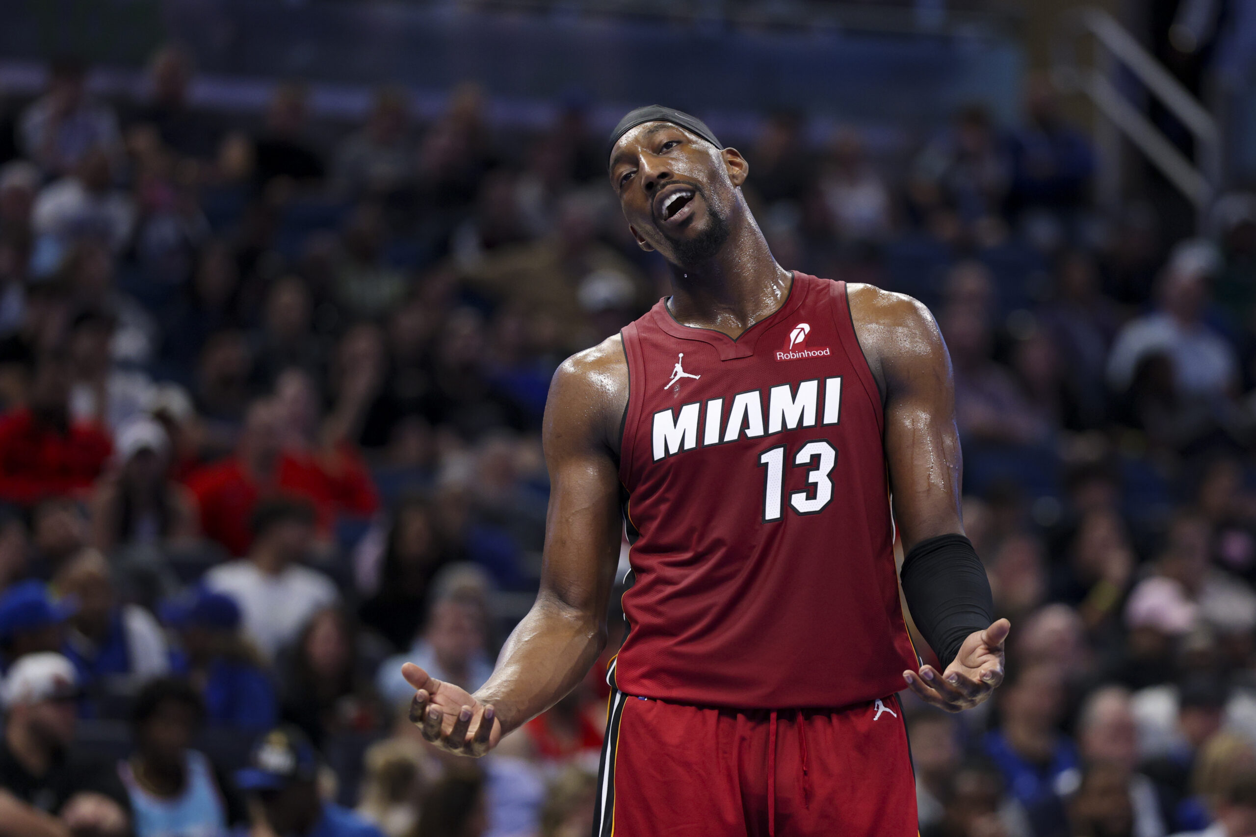 Dec 5, 2025; Orlando, Florida, USA; Miami Heat center Bam Adebayo (13) reacts after a call against the Orlando Magic in the fourth quarter at Kia Center. Mandatory Credit: Nathan Ray Seebeck-Imagn Images