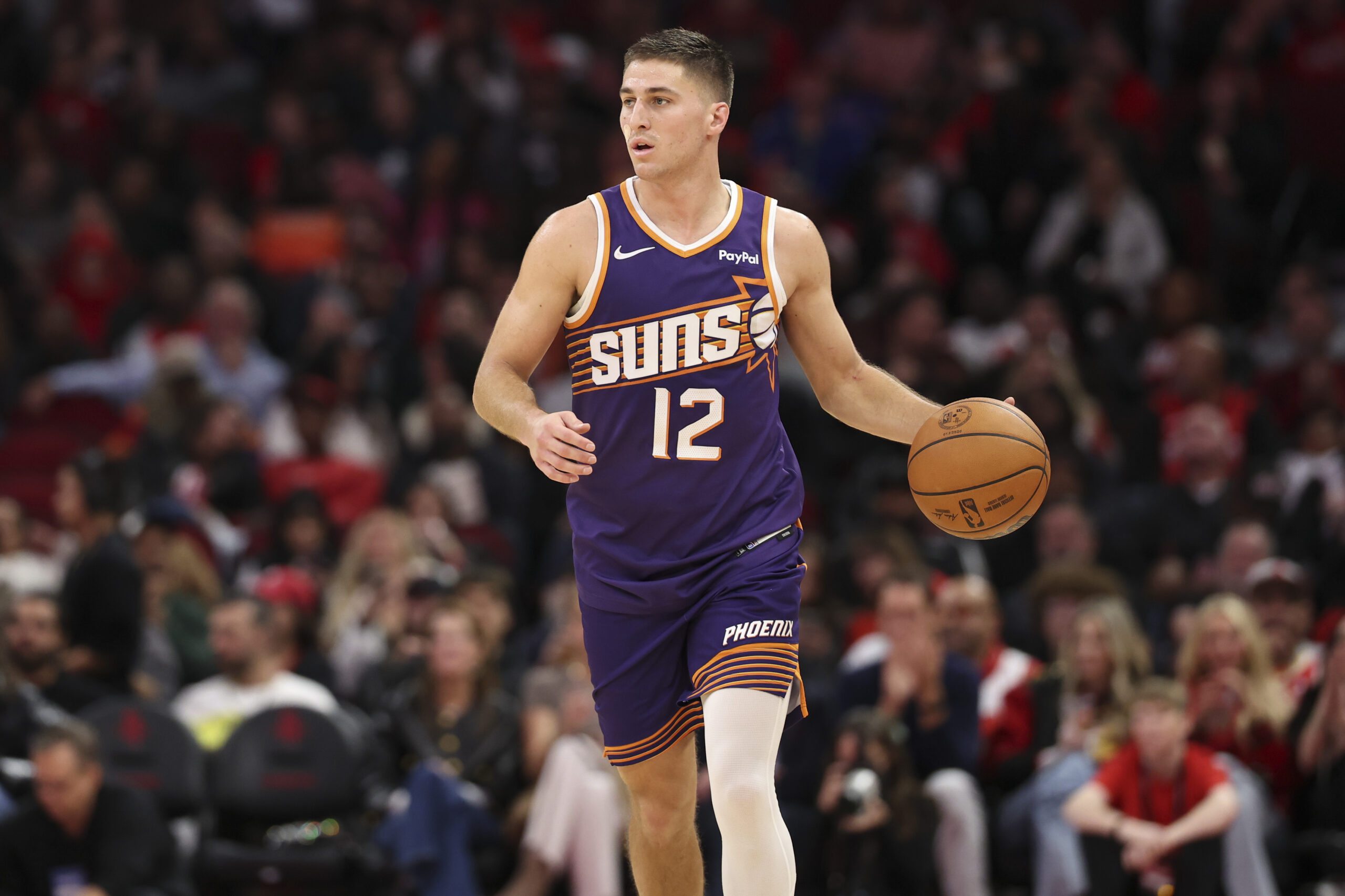 Dec 5, 2025; Houston, Texas, USA; Phoenix Suns guard Collin Gillespie (12) dribbles the ball during the fourth quarter against the Houston Rockets at Toyota Center. Mandatory Credit: Troy Taormina-Imagn Images