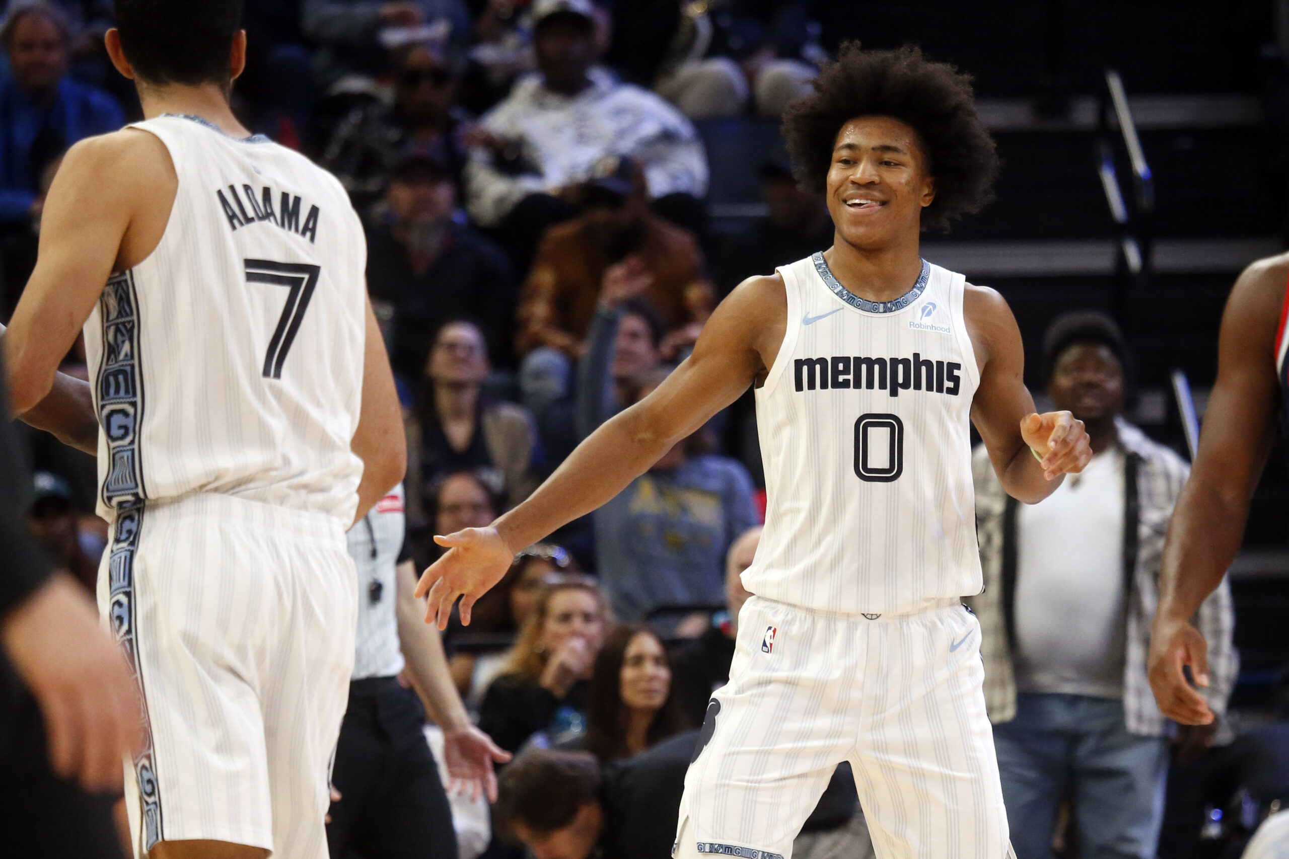 Dec 5, 2025; Memphis, Tennessee, USA; Memphis Grizzlies forward Jaylen Wells (0) reacts with forward Santi Aldama (7) during the third quarter against the Los Angeles Clippers at FedExForum. Mandatory Credit: Petre Thomas-Imagn Images