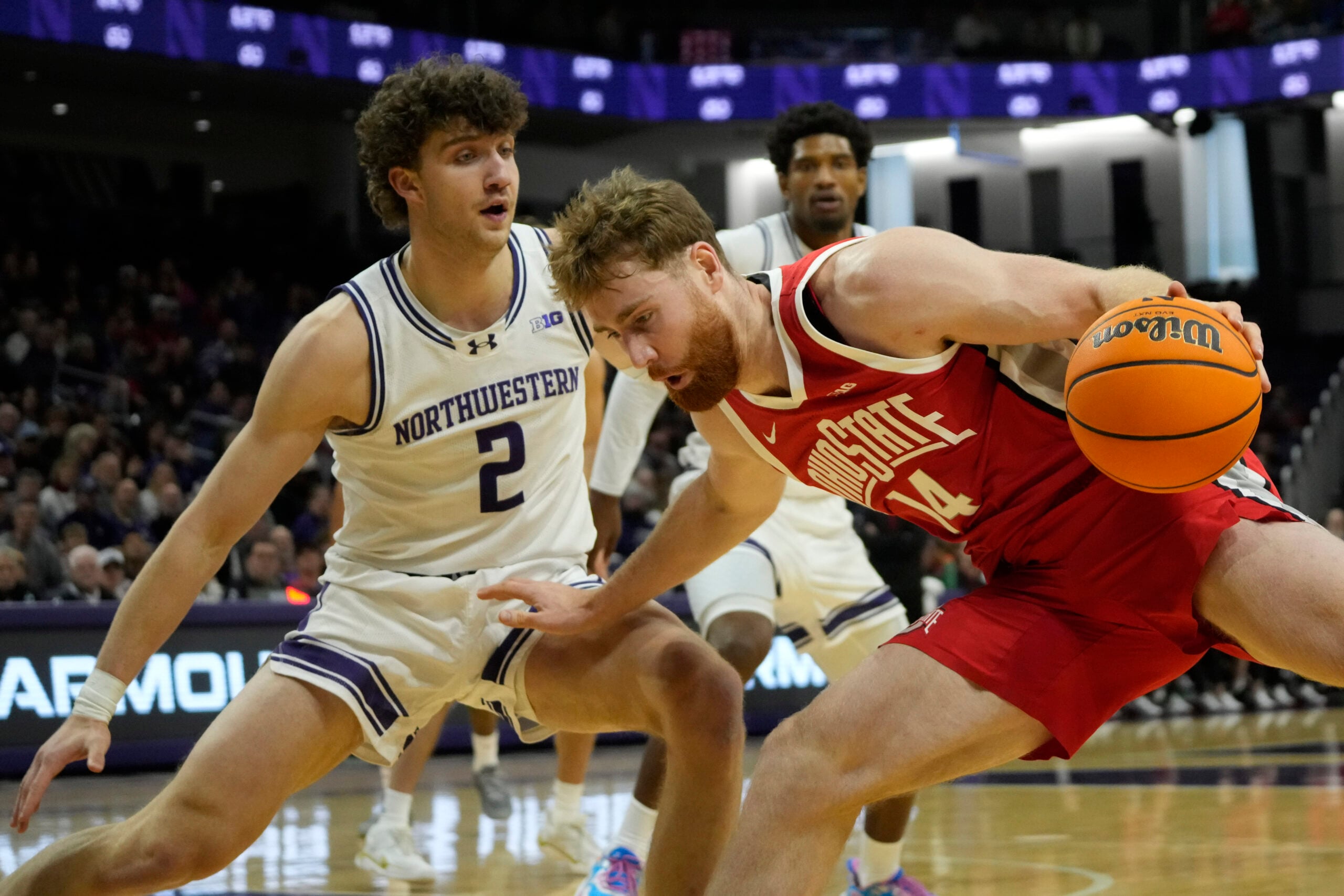 Dec 6, 2025; Evanston, Illinois, USA; Northwestern Wildcats forward Nick Martinelli (2) defends Ohio State Buckeyes forward Brandon Noel (14) during the first half at Welsh-Ryan Arena. Mandatory Credit: David Banks-Imagn Images