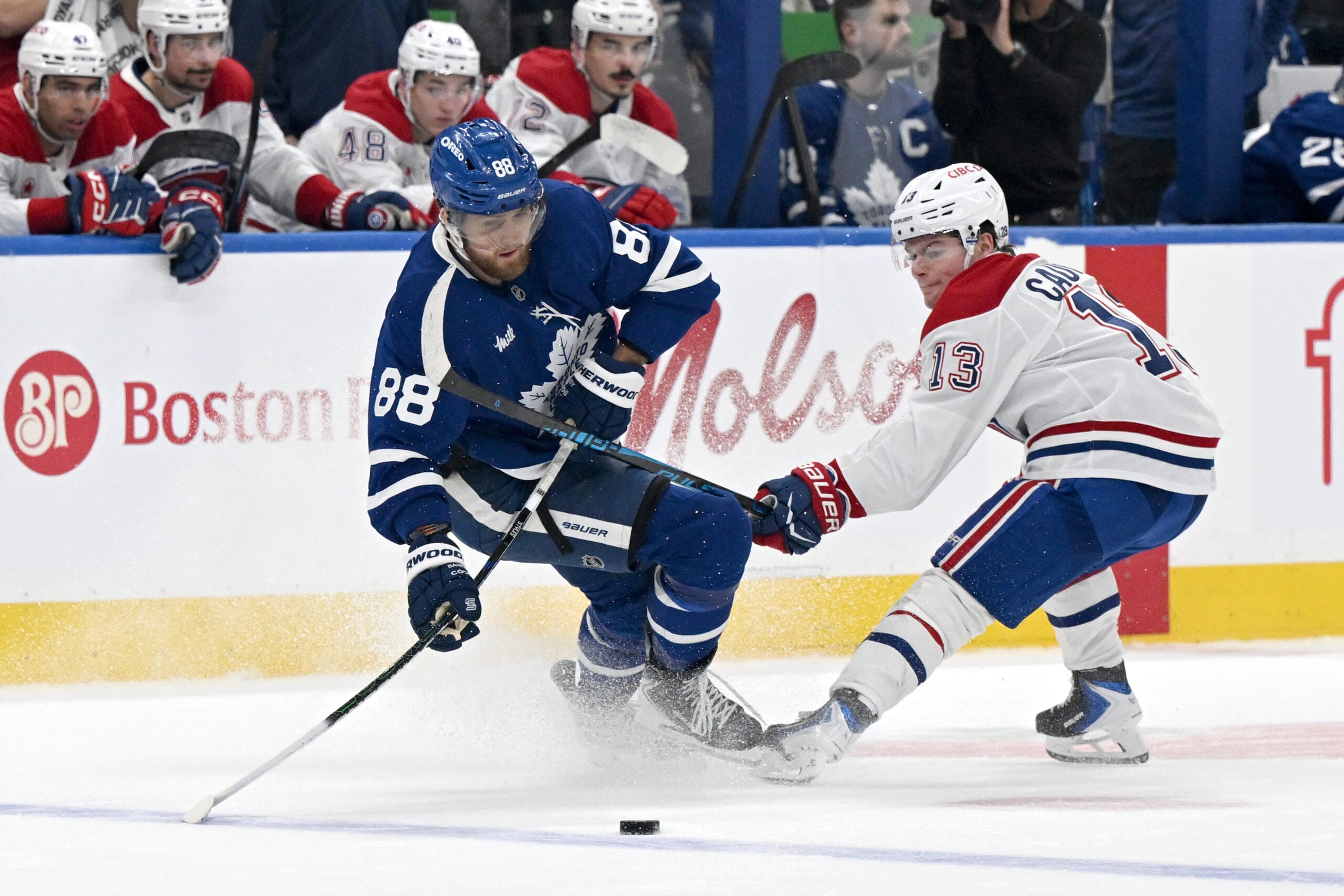 Dec 6, 2025; Toronto, Ontario, CAN; Toronto Maple Leafs forward William Nylander (88) moves the puck past Montreal Canadiens forward Cole Caufield (13) in the second period at Scotiabank Arena. Mandatory Credit: Dan Hamilton-Imagn Images