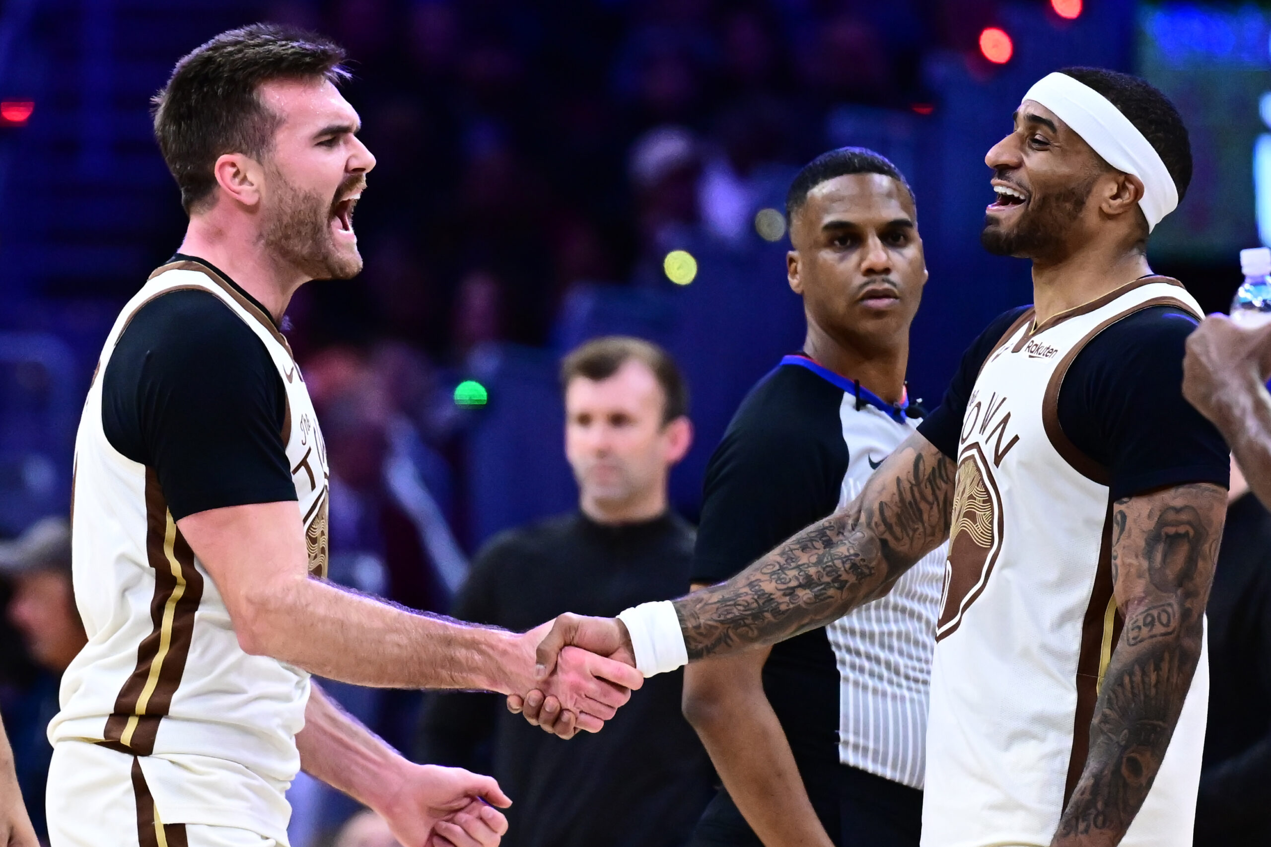 Dec 6, 2025; Cleveland, Ohio, USA; Golden State Warriors guard Pat Spencer (61) celebrates with guard Gary Payton II (0) against the Cleveland Cavaliers during the second half at Rocket Arena. Mandatory Credit: Ken Blaze-Imagn Images