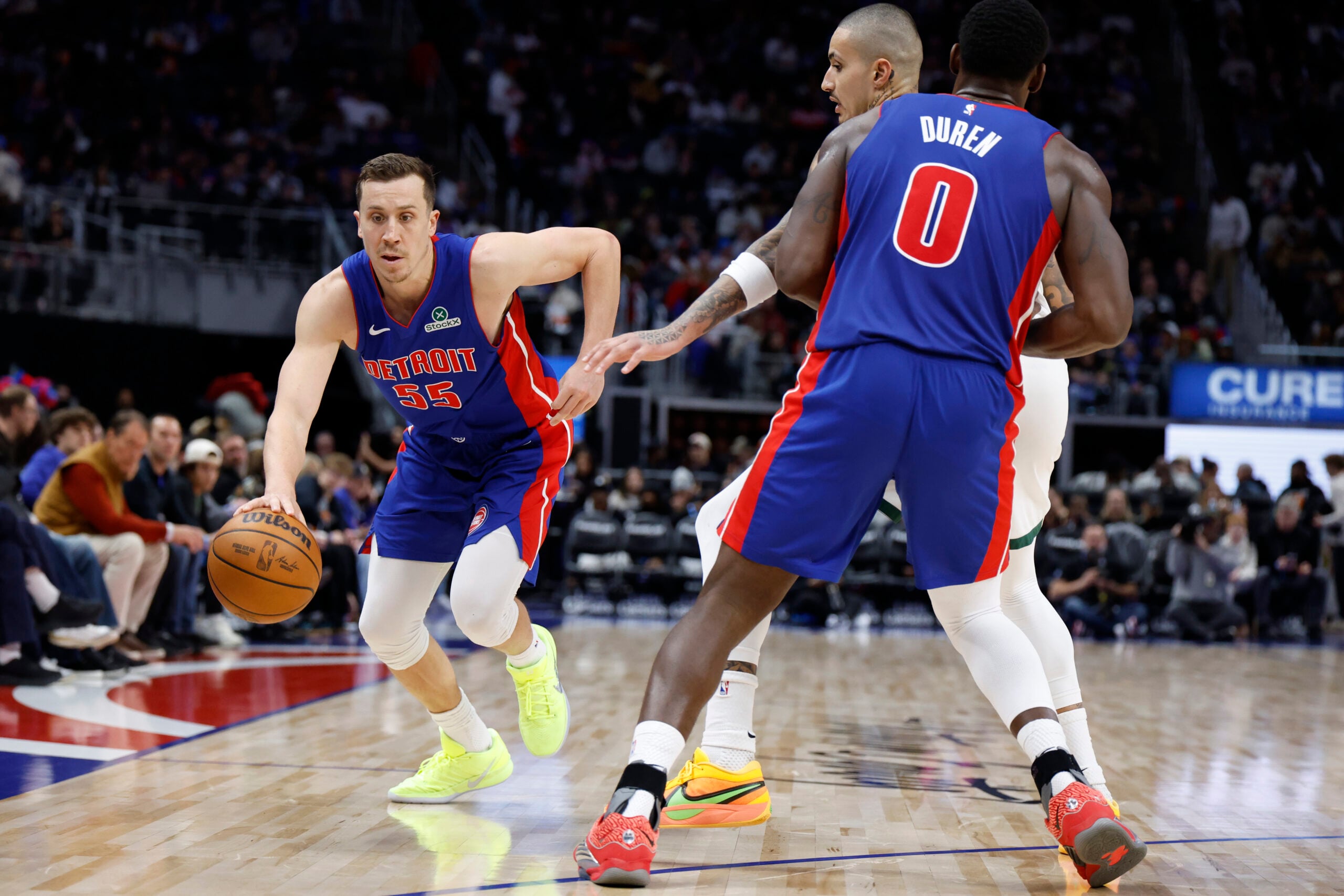 Dec 6, 2025; Detroit, Michigan, USA; Detroit Pistons forward Duncan Robinson (55) dribbles in the second half against the Milwaukee Bucks at Little Caesars Arena. Mandatory Credit: Rick Osentoski-Imagn Images