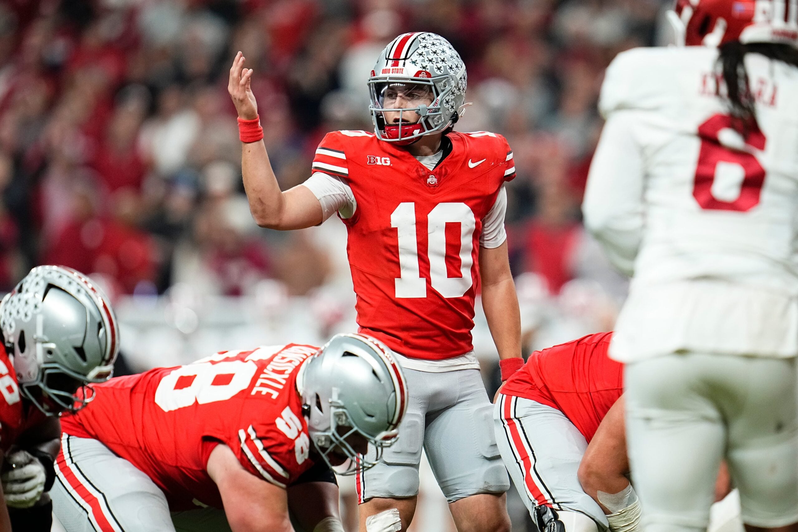 Ohio State Buckeyes quarterback Julian Sayin (10) motions during the Big Ten Conference championship game against the Indiana Hoosiers at Lucas Oil Stadium in Indianapolis on Dec. 6, 2025. Ohio State lost 13-10.