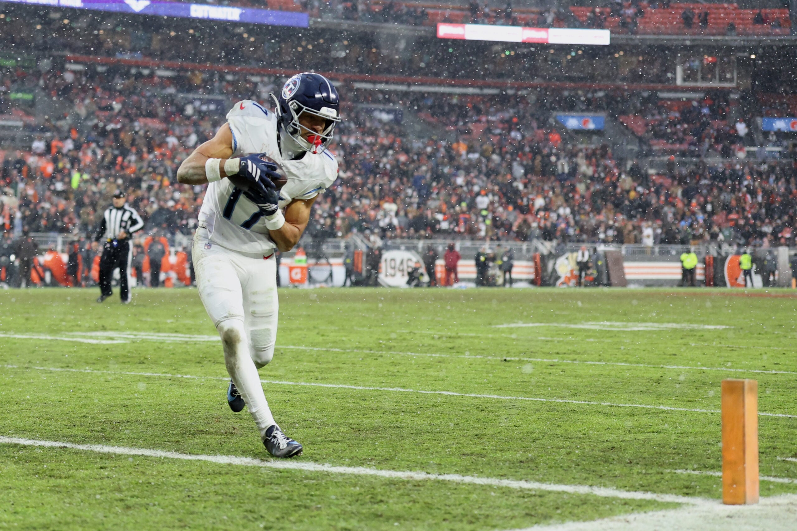 Dec 7, 2025; Cleveland, Ohio, USA; Tennessee Titans wide receiver Chimere Dike (17) catches a five-yard touchdown pass thrown by quarterback Cam Ward (not pictured) against the Cleveland Browns during the fourth quarter at Huntington Bank Field. Mandatory Credit: Scott Galvin-Imagn Images