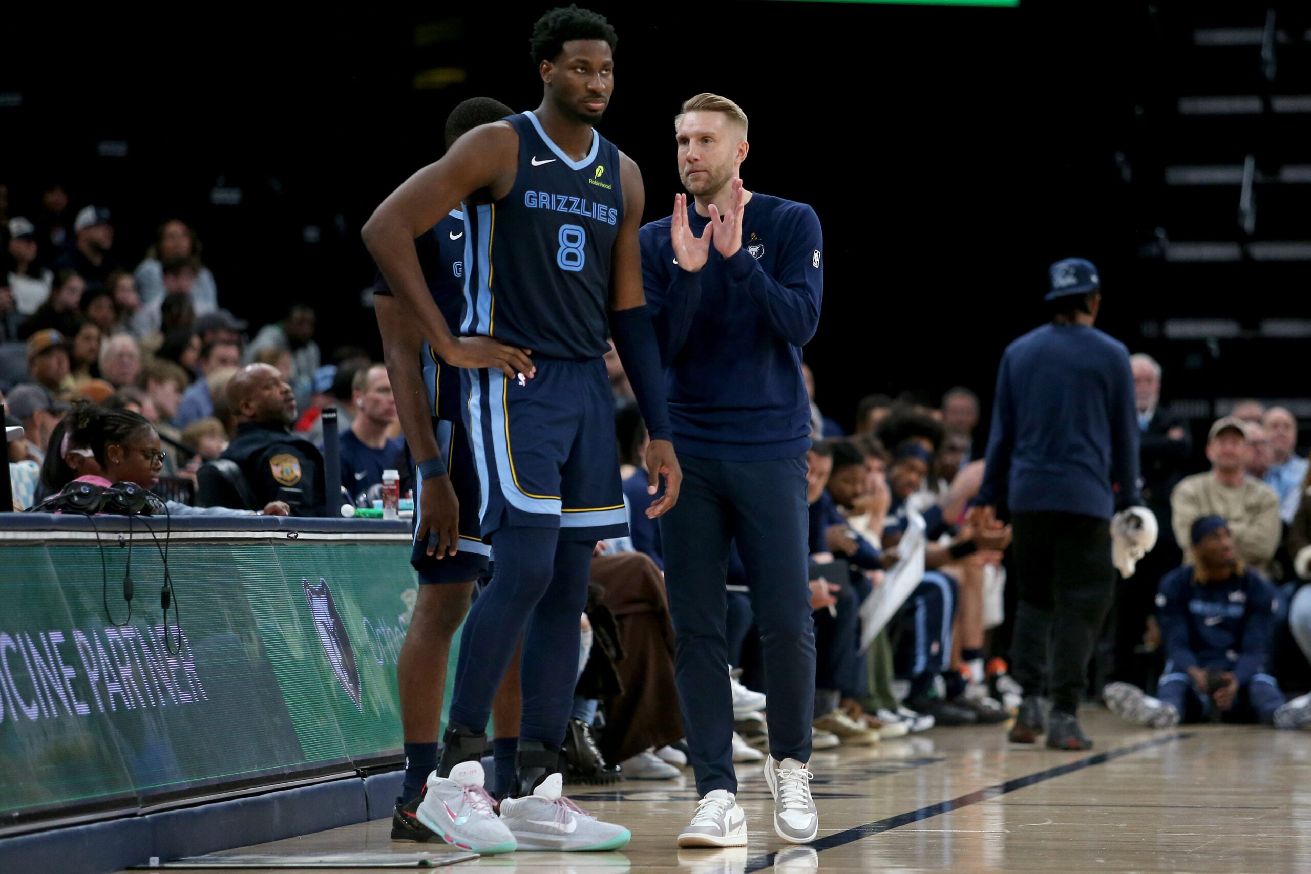 Dec 7, 2025; Memphis, Tennessee, USA; Memphis Grizzlies head coach Tuomas Iisalo talks with forward/center Jaren Jackson Jr. (8) during the third quarter against the Portland Trail Blazers at FedExForum. Mandatory Credit: Petre Thomas-Imagn Images