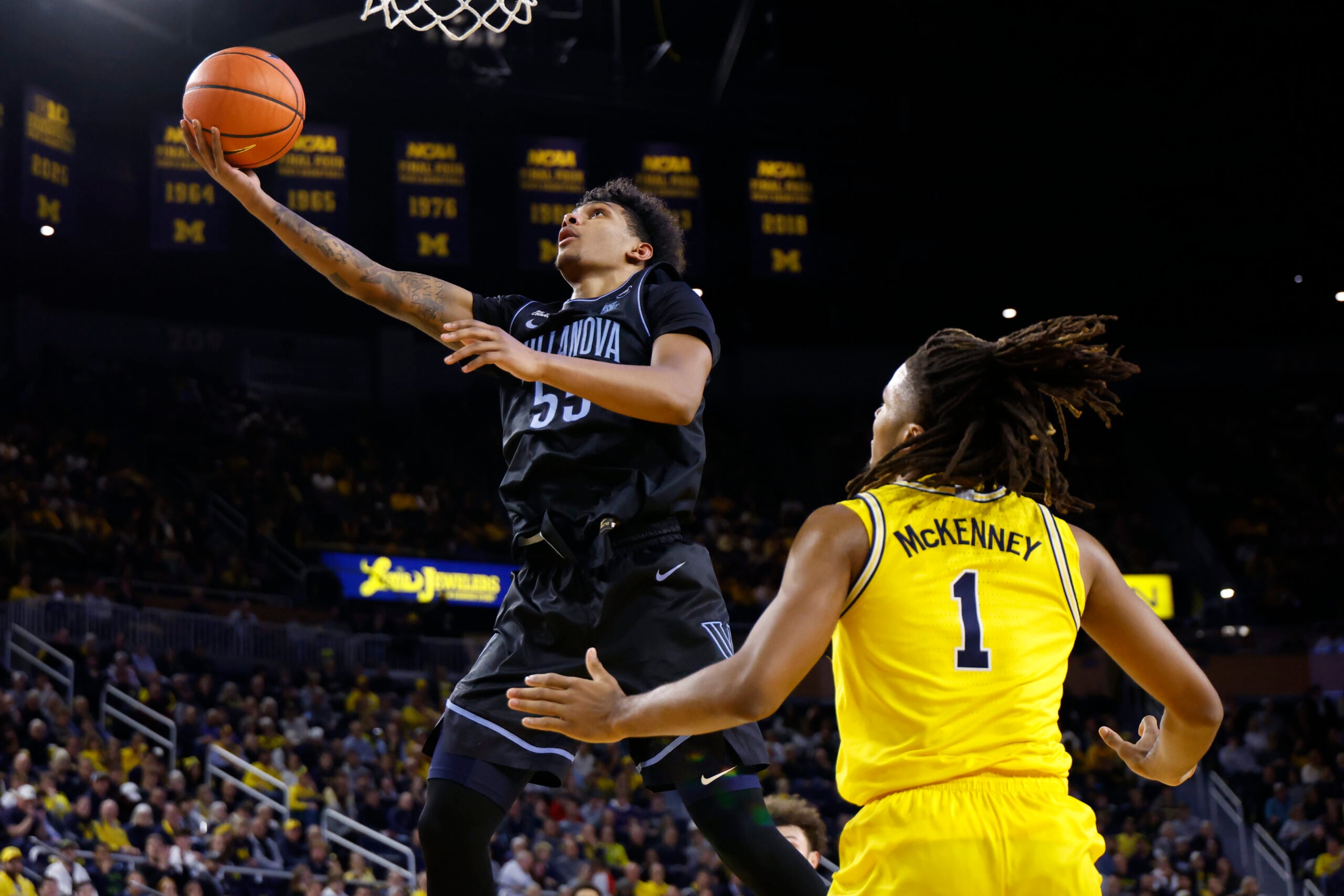 Dec 9, 2025; Ann Arbor, Michigan, USA; Villanova Wildcats guard Acaden Lewis (55) shoots on Michigan Wolverines guard Trey McKenney (1) in the second half at Crisler Center. Mandatory Credit: Rick Osentoski-Imagn Images