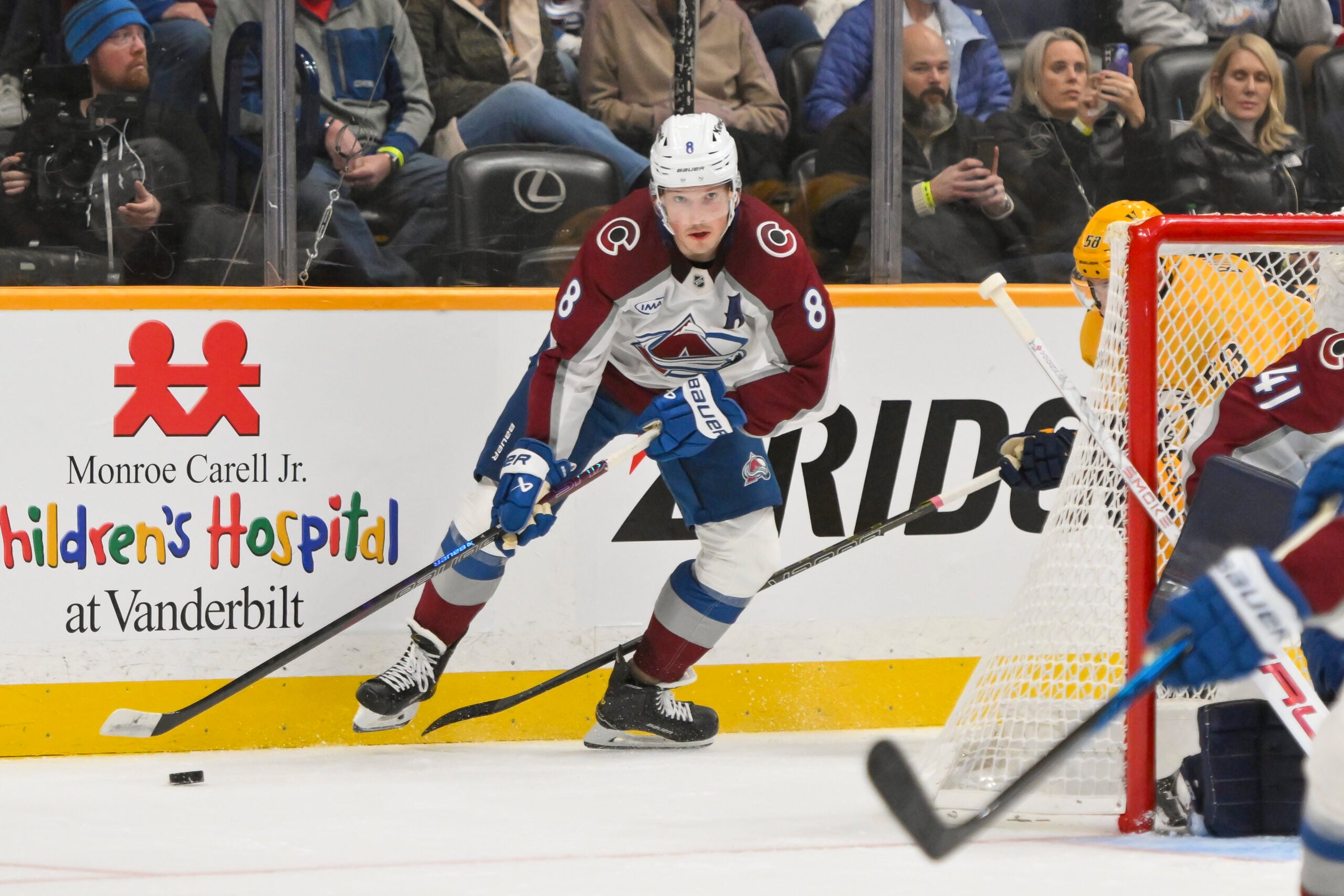 Dec 9, 2025; Nashville, Tennessee, USA;  Colorado Avalanche defenseman Cale Makar (8) skates behind the net against the Nashville Predators during the second period at Bridgestone Arena. Mandatory Credit: Steve Roberts-Imagn Images
