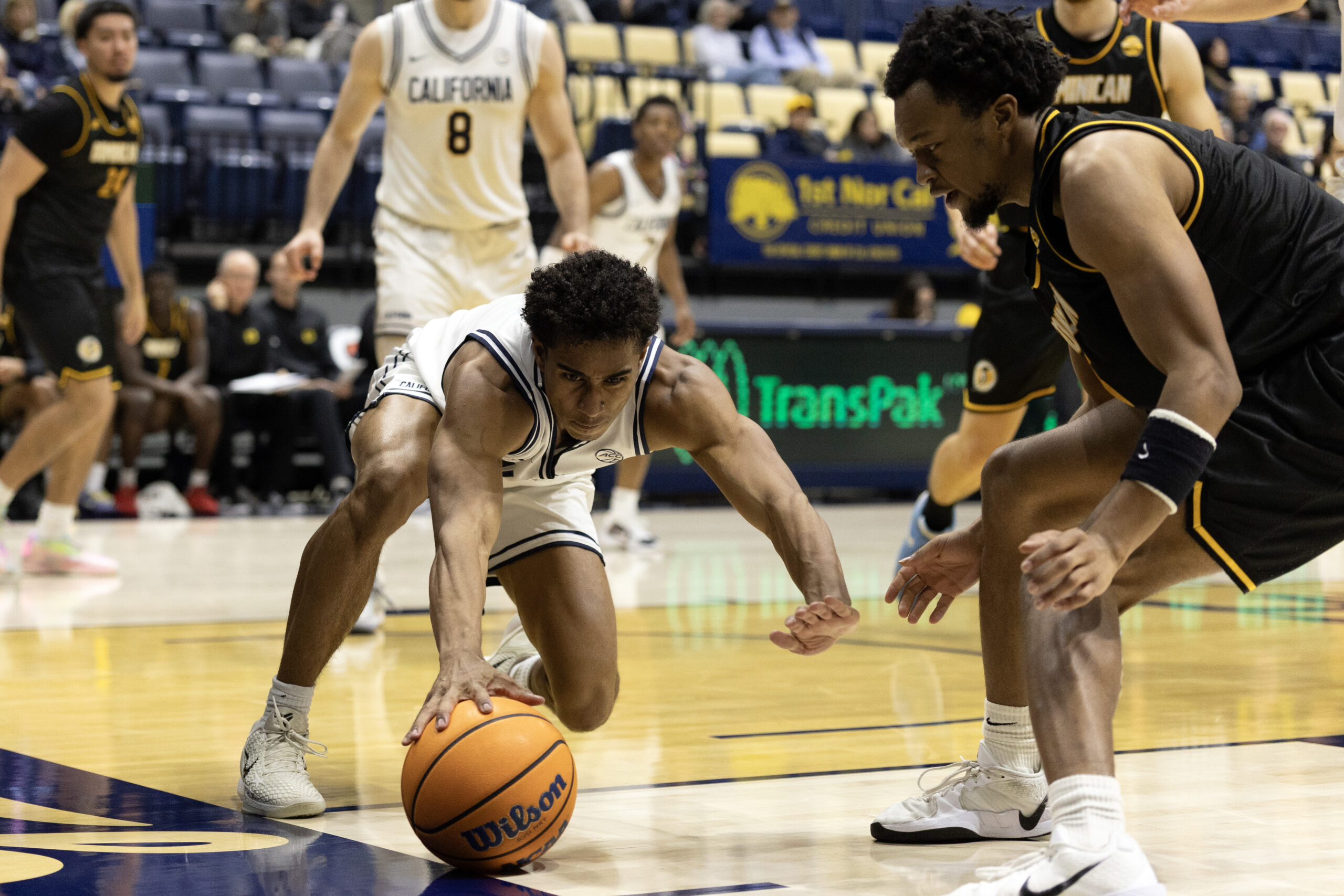 Dec 9, 2025; Berkeley, California, USA; California Golden Bears guard Semetri (TT) Carr (3) and Dominican Penguins forward Sargent Jeffery (22) both vie for the ball during the second half at Haas Pavilion. Mandatory Credit: D. Ross Cameron-Imagn Images