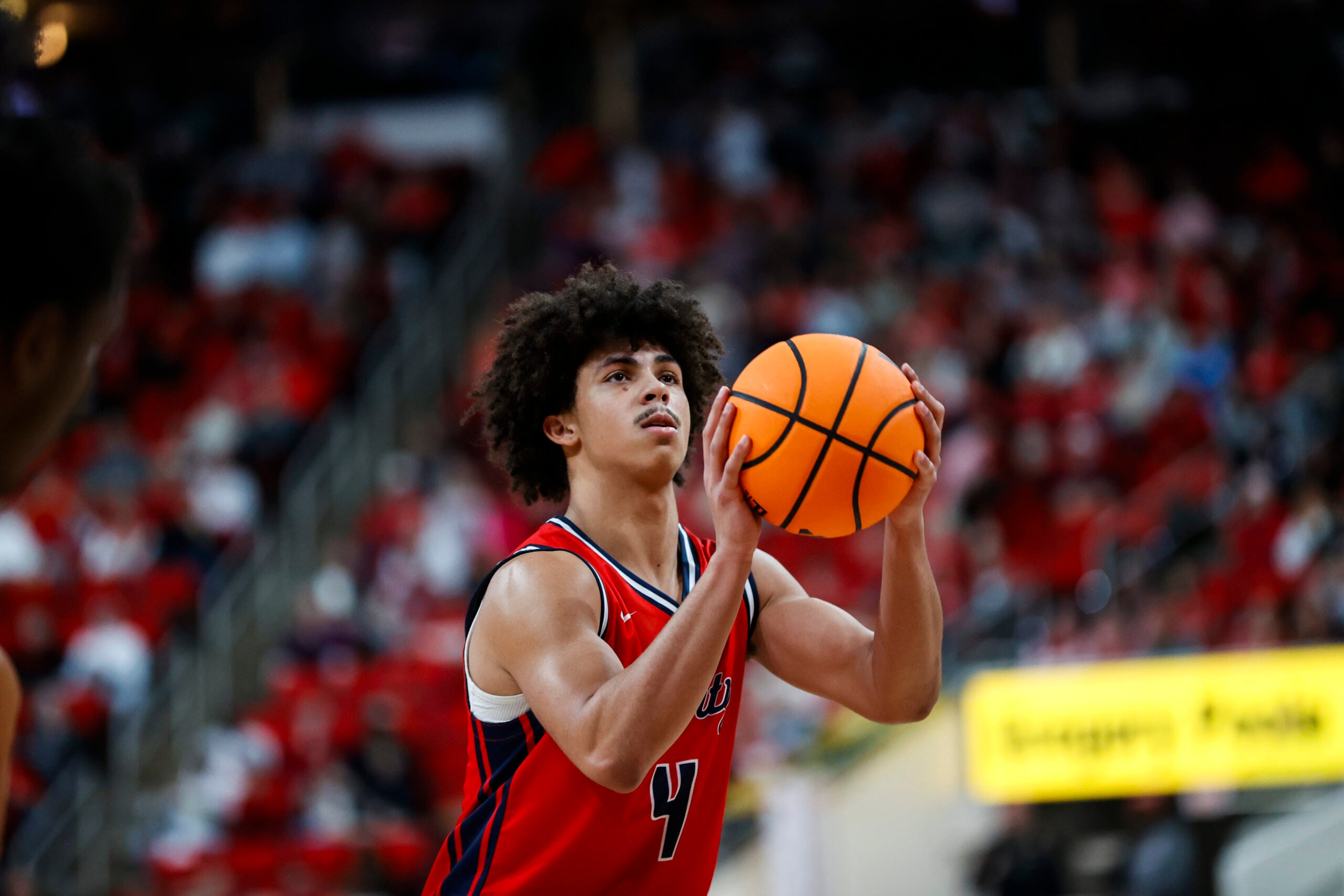 Dec 6, 2025; Raleigh, North Carolina, USA;
Liberty Flames guard Brett Decker Jr. (4) shoots a free throw during the second half of the game against the NC State Wolfpack at Lenovo Center. Mandatory Credit: Jaylynn Nash-Imagn Images