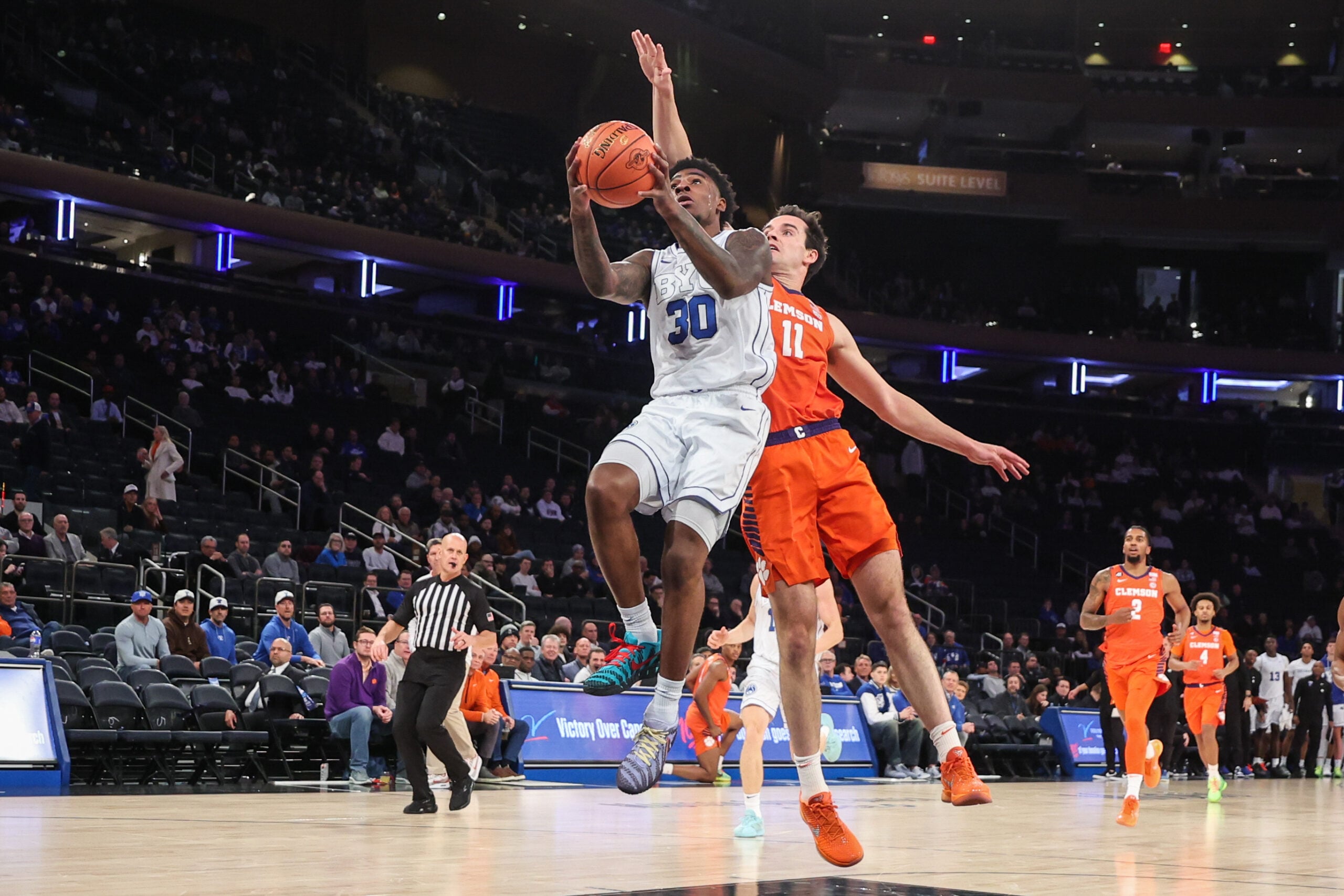 Dec 9, 2025; New York, New York, USA; BYU Cougars guard Kennard Davis Jr. (30) and Clemson Tigers forward Nick Davidson (11) at Madison Square Garden. Mandatory Credit: Wendell Cruz-Imagn Images