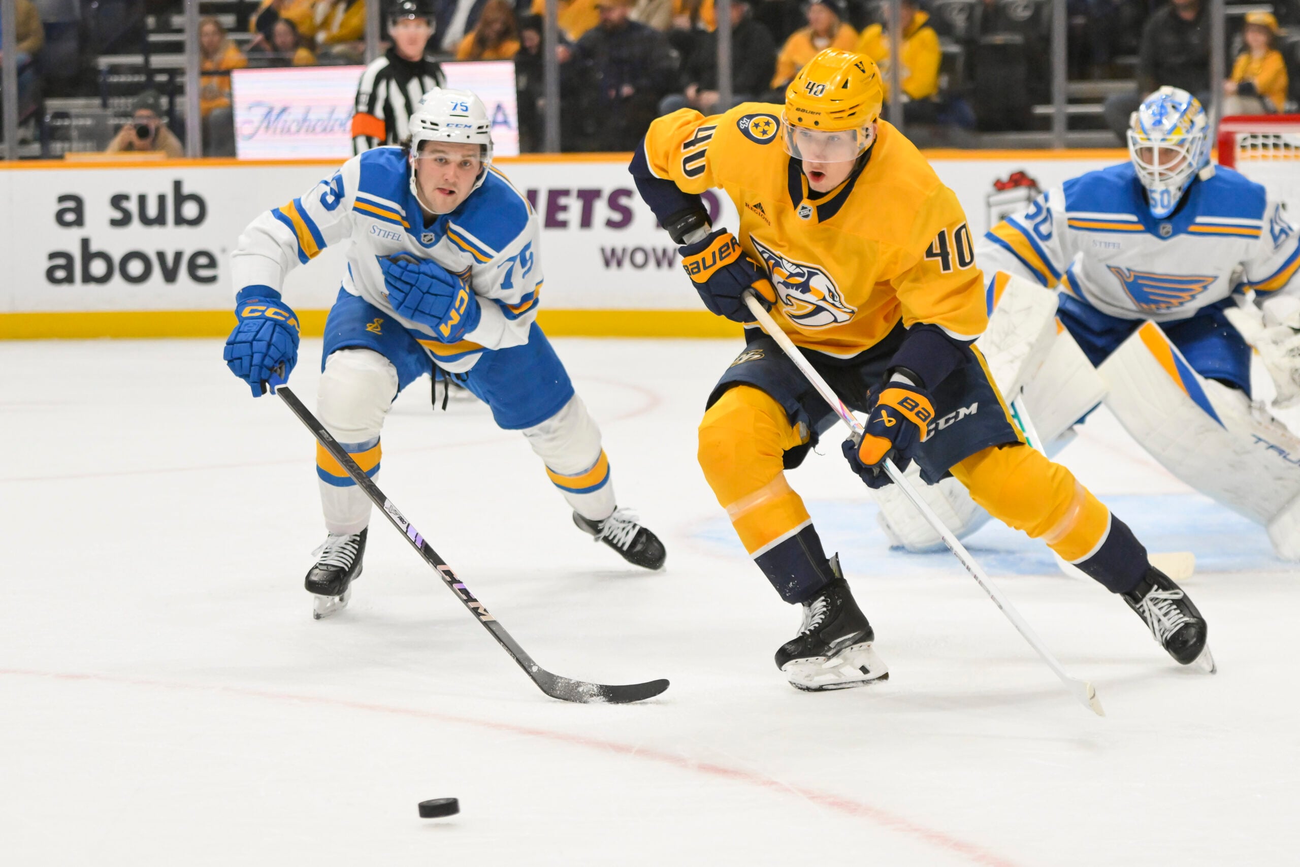 Dec 11, 2025; Nashville, Tennessee, USA; Nashville Predators center Fedor Svechkiv (40) skates with the puck against the St. Louis Blues during the first period at Bridgestone Arena. Mandatory Credit: Steve Roberts-Imagn Images