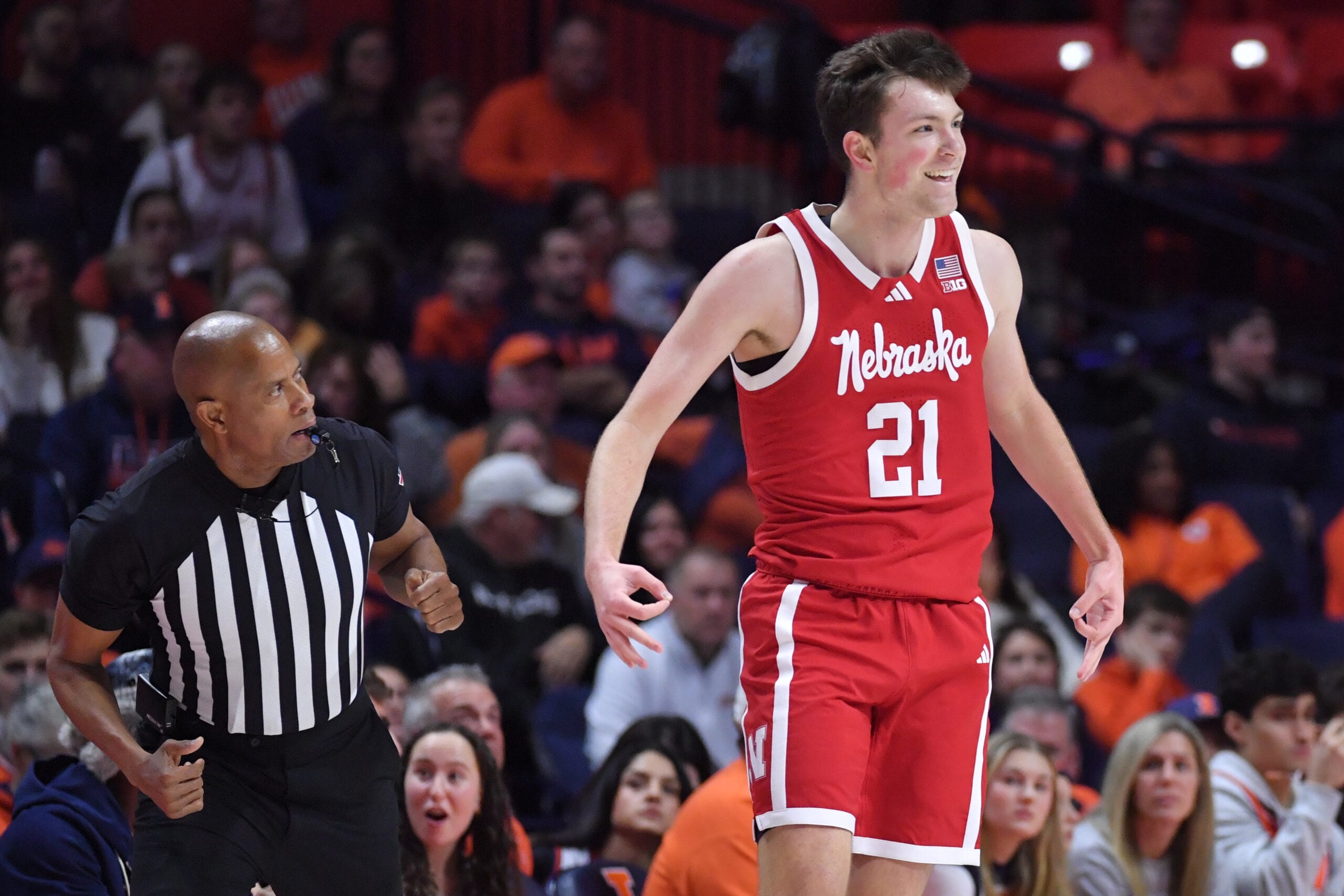 Dec 13, 2025; Champaign, Illinois, USA; Nebraska Cornhuskers forward Pryce Sandfort (21) reacts after hitting a three-point shot during the first half against the Illinois Fighting Illini at State Farm Center. Mandatory Credit: Ron Johnson-Imagn Images