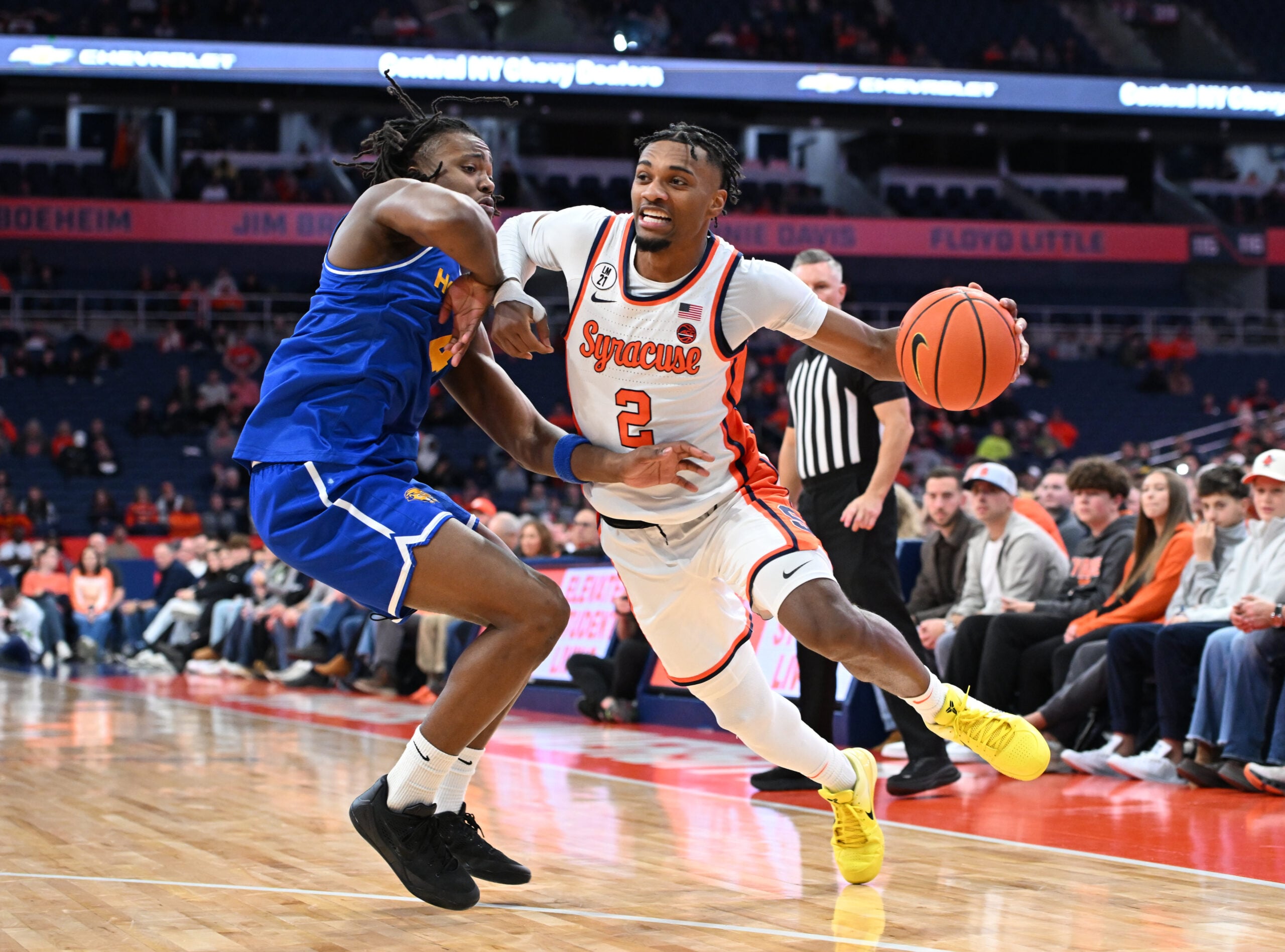 Dec 13, 2025; Syracuse, New York, USA; Syracuse Orange guard JJ Starling (2) drives against Hofstra Pride forward Joshua Decady (4) in the second half at the JMA Wireless Dome. Mandatory Credit: Mark Konezny-Imagn Images