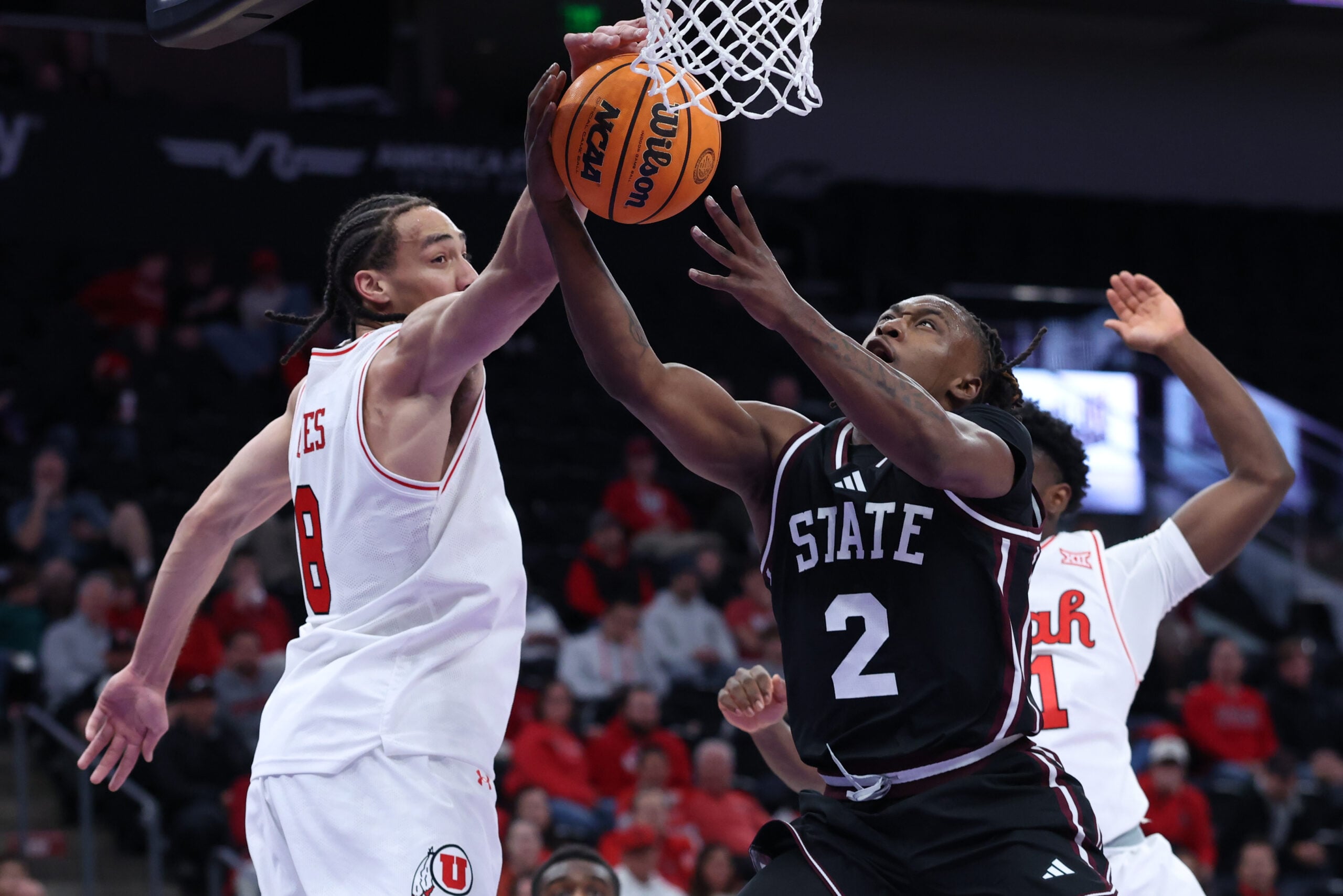 Dec 13, 2025; Salt Lake City, Utah, USA; Mississippi State Bulldogs guard Ja'Borri McGhee (2) has a shot blocked by Utah Utes forward Keanu Dawes (8) during the first half at Delta Center. Mandatory Credit: Rob Gray-Imagn Images