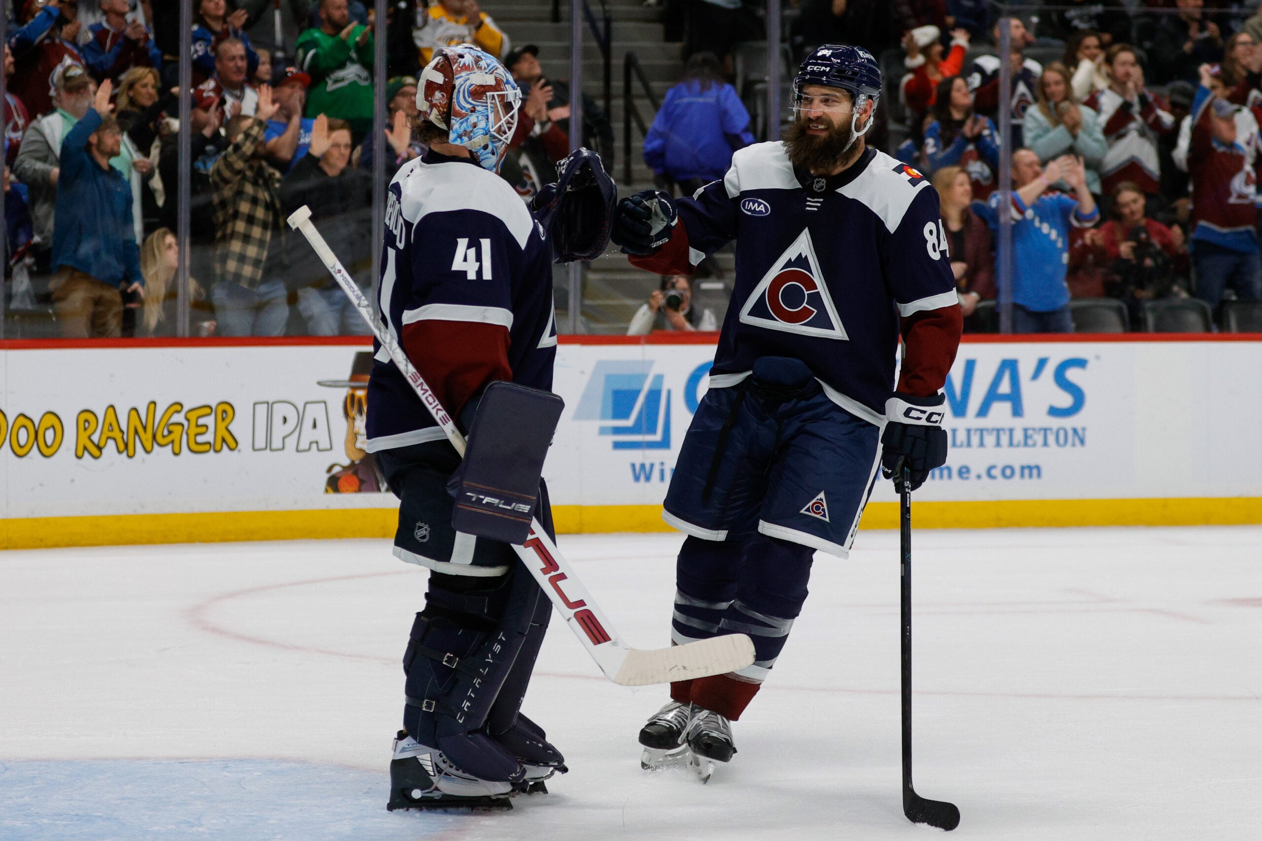Dec 13, 2025; Denver, Colorado, USA; Colorado Avalanche defenseman Brent Burns (84) celebrates with goaltender Scott Wedgewood (41) after the game against the Nashville Predators at Ball Arena. Mandatory Credit: Isaiah J. Downing-Imagn Images