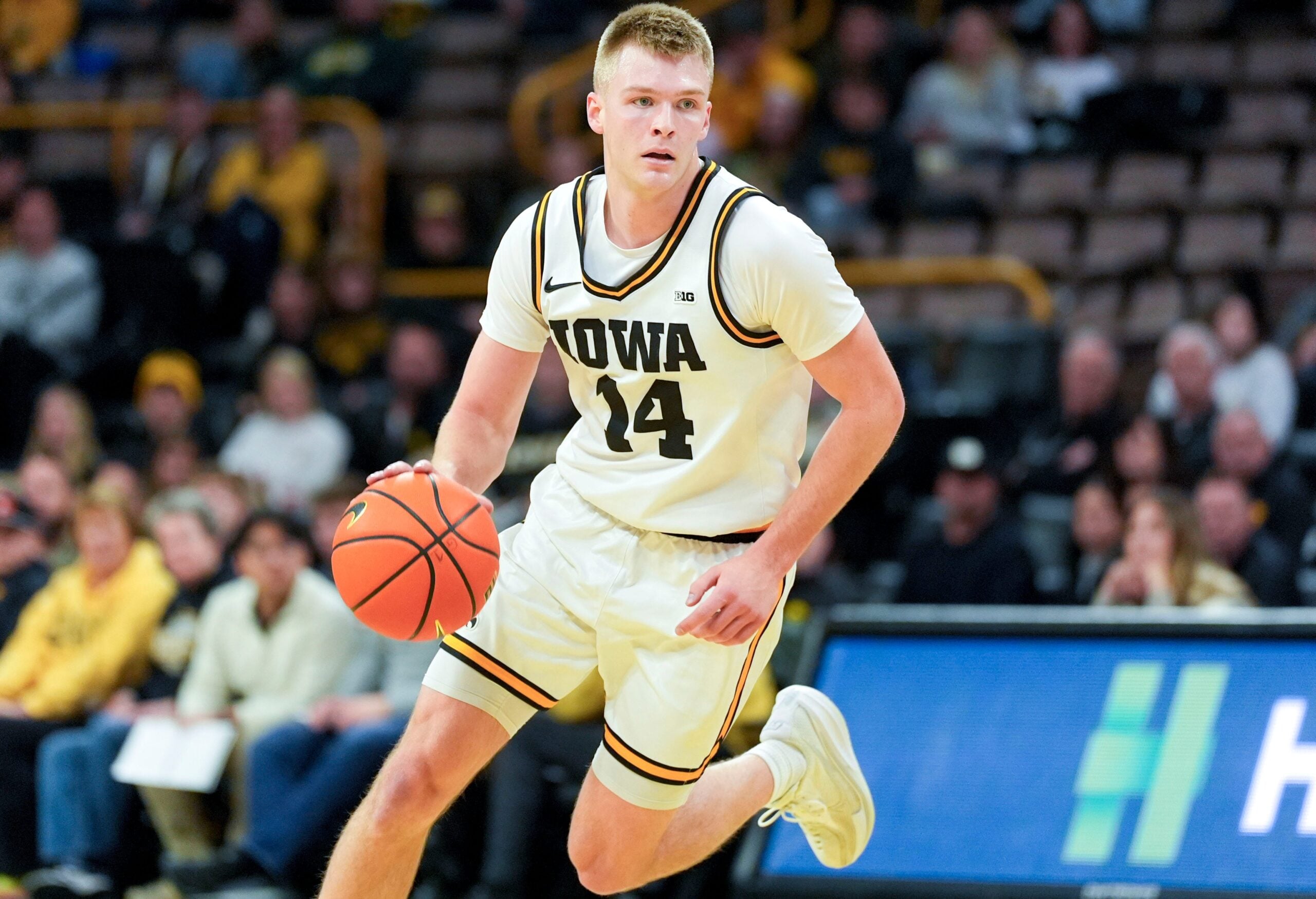 Iowa guard Bennett Stirtz (14) dribbles the basketball during a game against the Western Michigan Broncos Dec. 14, 2025 at Carver-Hawkeye Arena in Iowa City, Iowa.