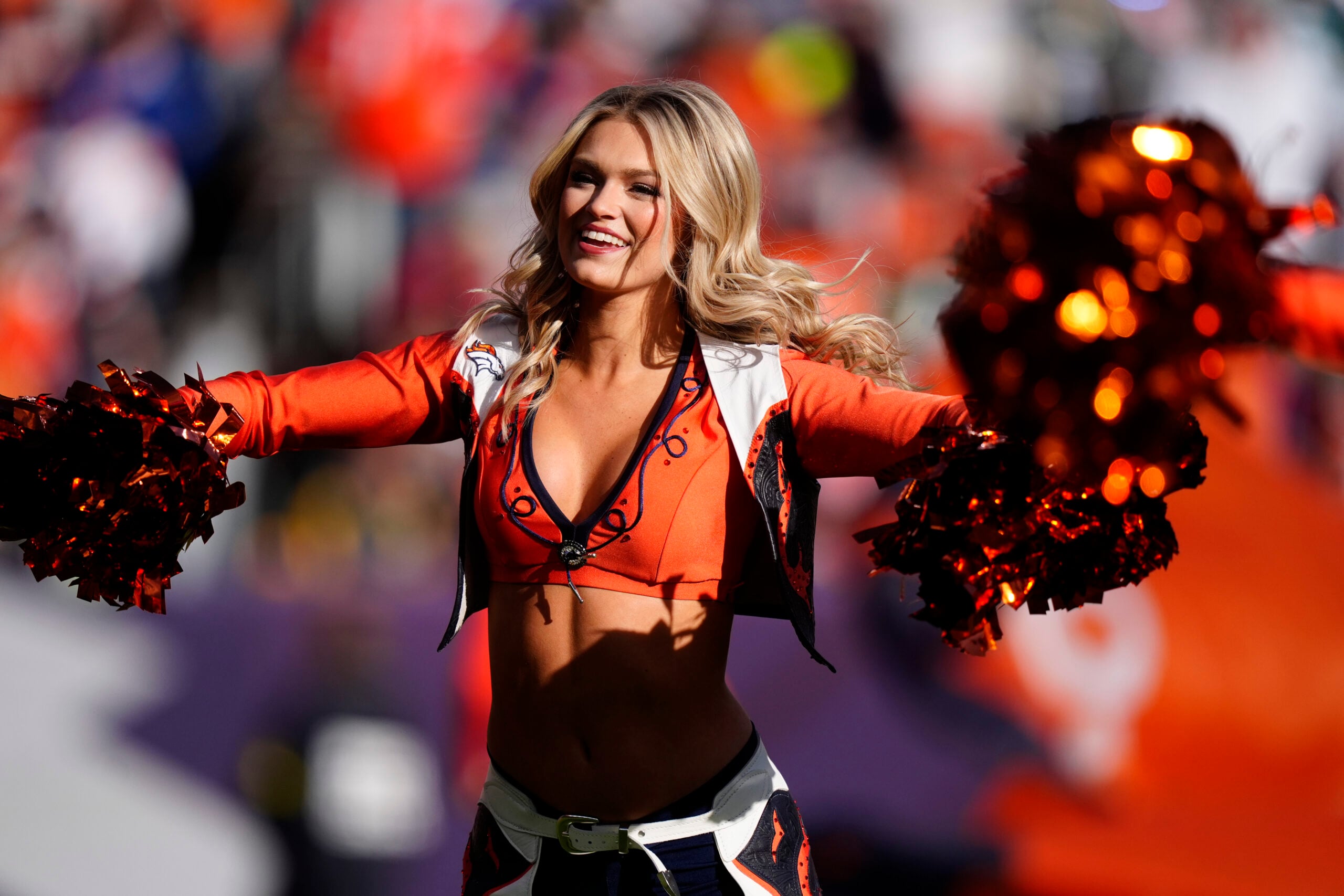 Dec 14, 2025; Denver, Colorado, USA; A Denver Broncos cheerleader performs prior to a game against the Green Bay Packers at Empower Field at Mile High. Mandatory Credit: Ron Chenoy-Imagn Images