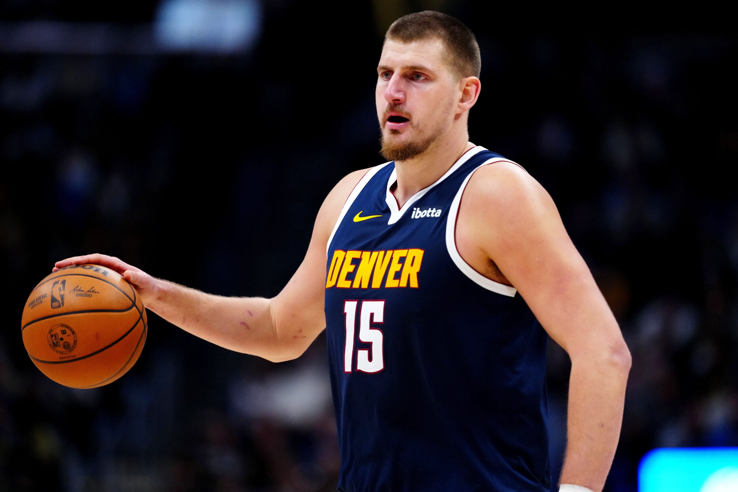 Dec 15, 2025; Denver, Colorado, USA; Denver Nuggets center Nikola Jokic (15) controls the ball in the fourth quarter against the Houston Rockets at Ball Arena. Mandatory Credit: Ron Chenoy-Imagn Images