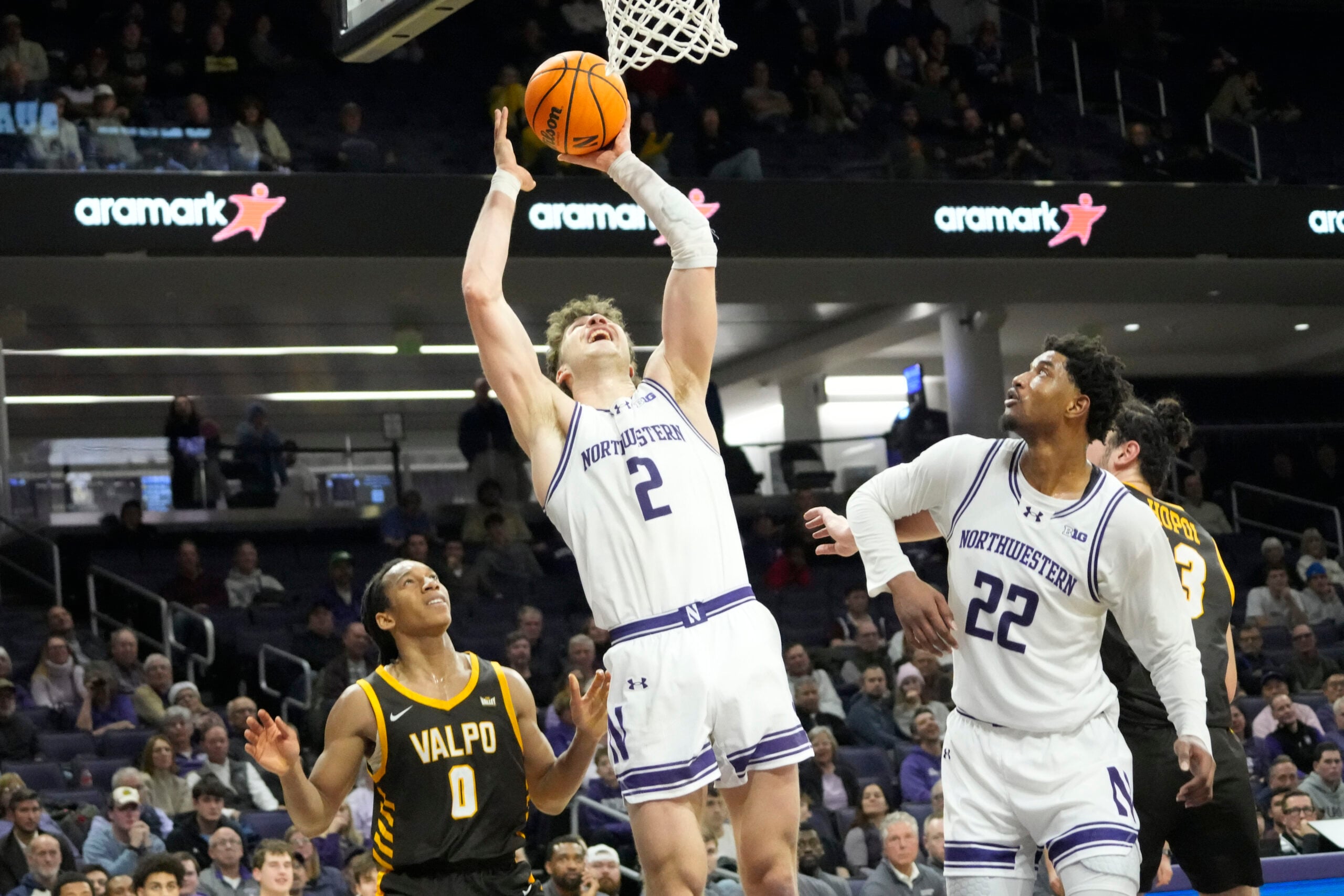 Dec 16, 2025; Evanston, Illinois, USA; Valparaiso Beacons guard Rakim Chaney (0) defends Northwestern Wildcats forward Nick Martinelli (2) during the second half at Welsh-Ryan Arena. Mandatory Credit: David Banks-Imagn Images